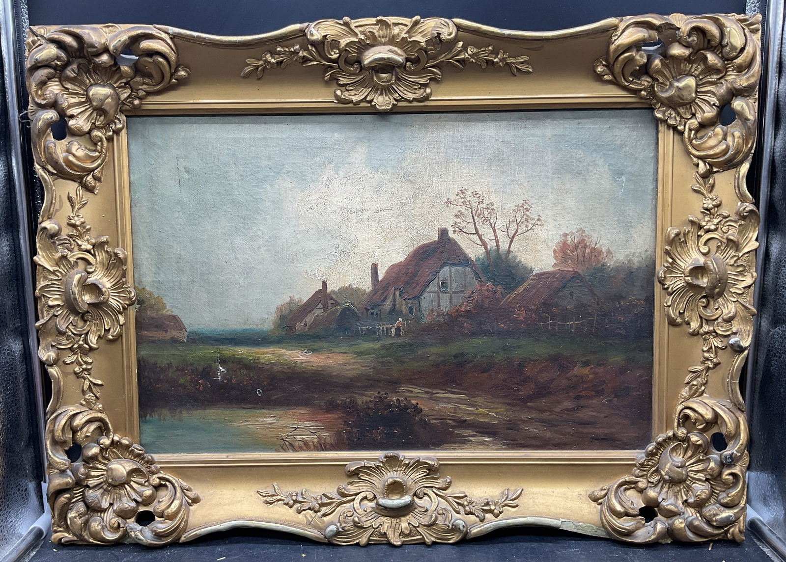 Antique Framed Cottage Landscape Oil Painting: Framed antique oil on canvas painting. Pastoral scene. View of cottage with landscape. Ornate gilt wood frame. Not examined out of frame. Frame measures approx 17 x 22.5 inches. Wear including