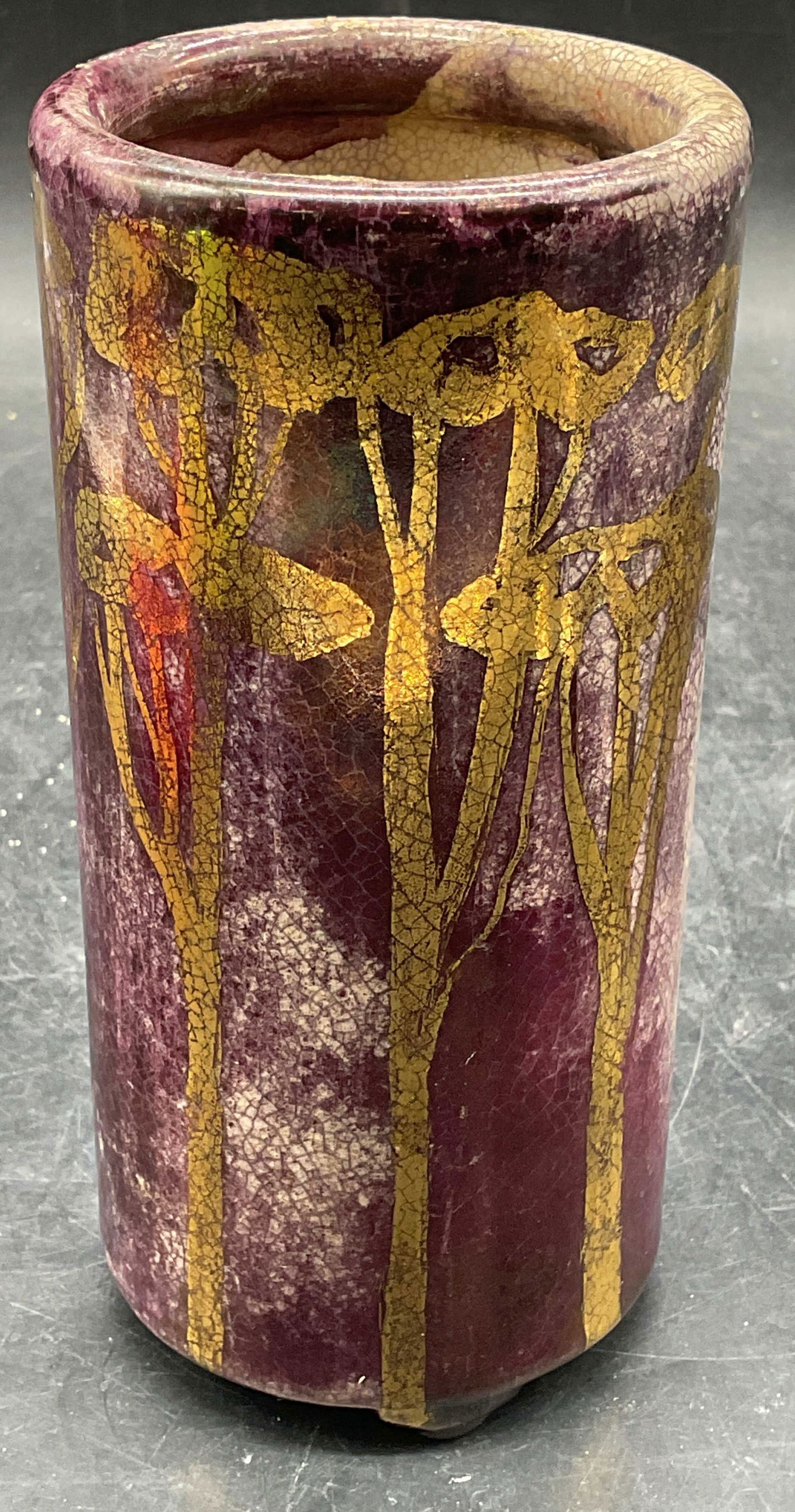 LR Foster Royal Art Nouveau Gilt Ceramic Vase: Antique art nouveau ceramic vase. Signed LR Foster Royal. Footed cylinder with hand painted gilt floral design and purple and white drip glaze. Measures approx 3 x 6.5 inches. Wear including crazing a