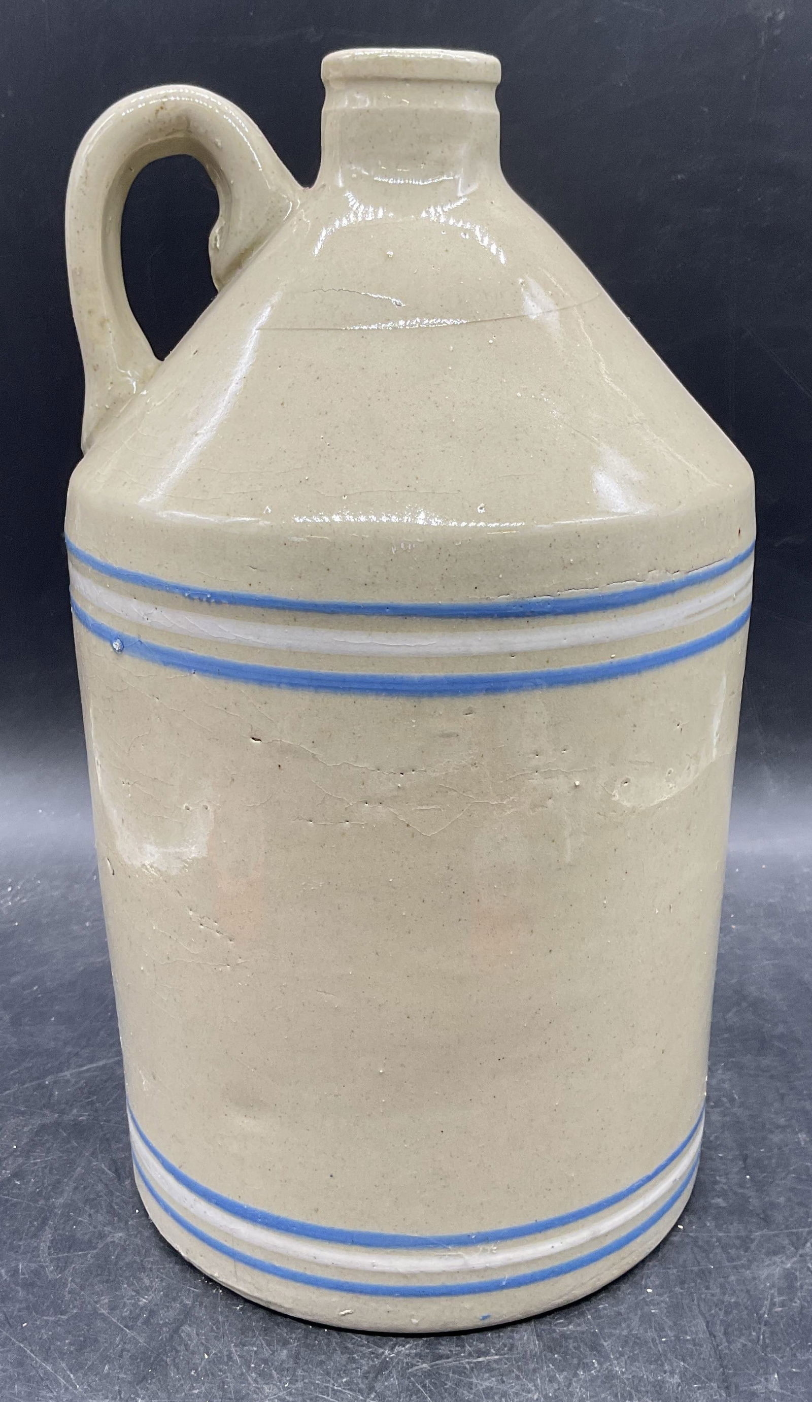 Antique Stoneware Blue Banded Jug 11.5 in Tall: Antique stoneware jug. Hand painted glaze in beige its blue and white banded design. Measures approx 6 x 11.5 inches. Wear including crazing. Jug, antique jug, stoneware jug, banded jug, antiques,