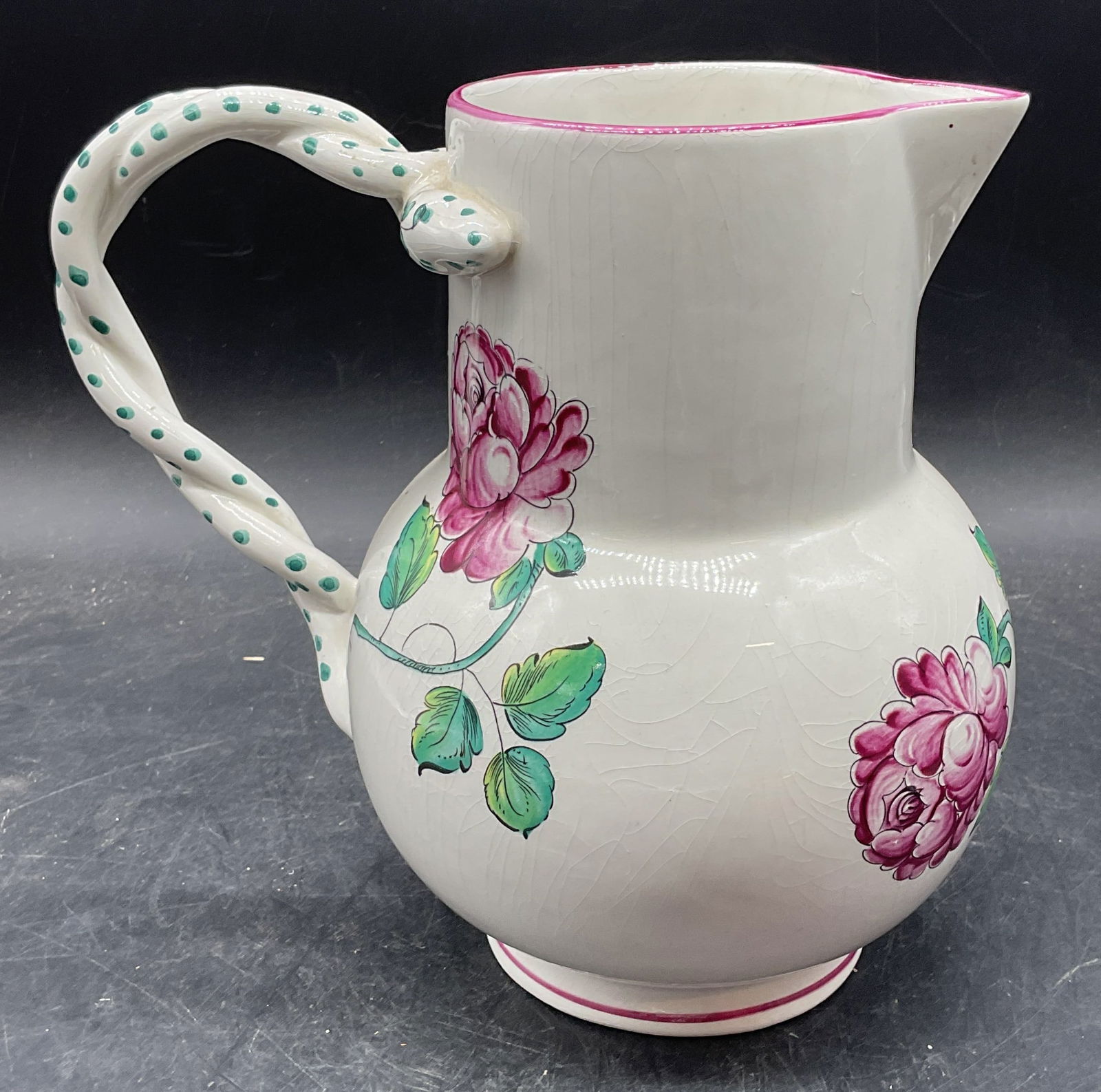Tiffany&Co Strasbourg Flower Porc Pitcher Portugal: Vintage Tiffany & Co Strasbourg Flowers pattern porcelain pitcher. Twisted Handel with dot design. Purple flowers in bowl. Signed. Made in Portugal. Measures approx 9 x 5.5 x 8.25 inches. Wear