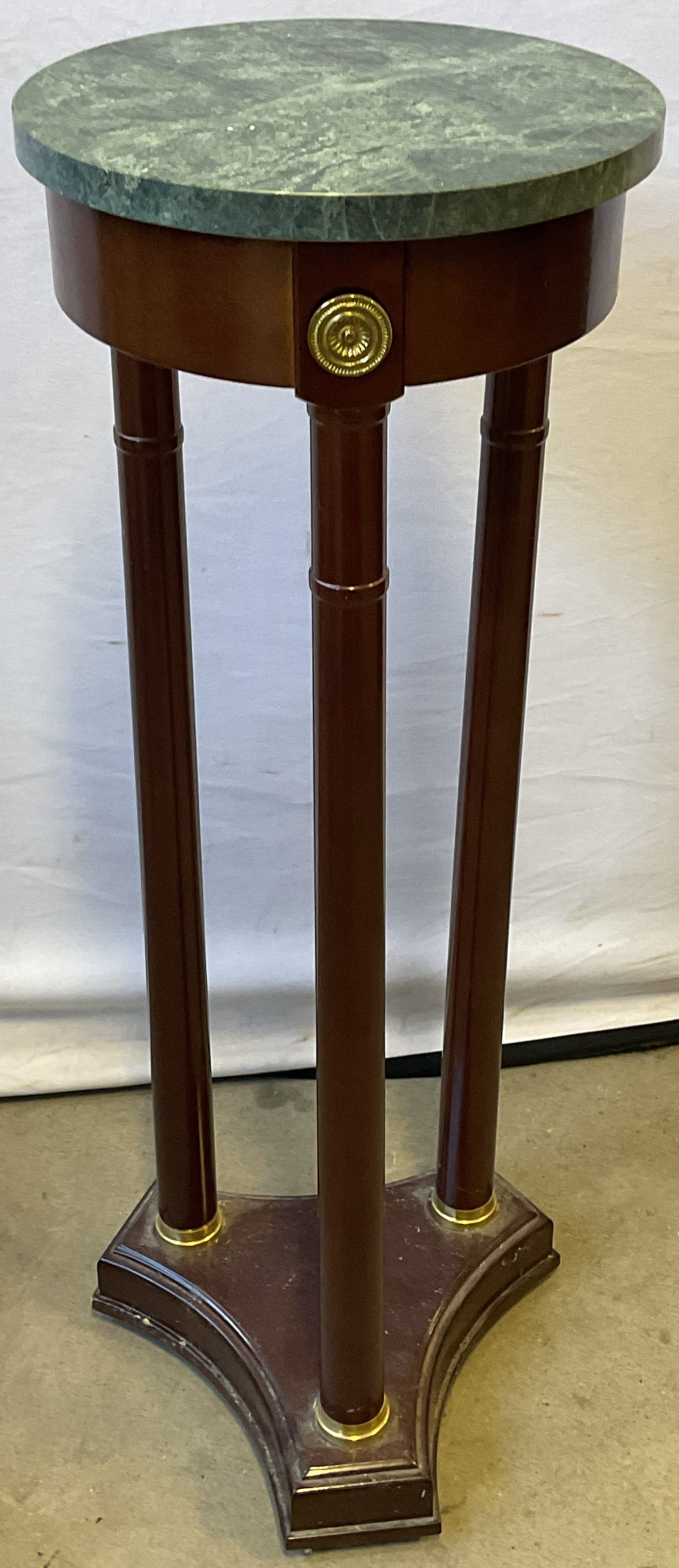 Bombay Neoclassical Mahogany Marble Side Table: Bombay Company mahogany and green marble neoclassical empire style 3 leg round accent table or plant stand Decorative brass hardware. Measures approx 11 x 31.75 inches. Signed on label. Some