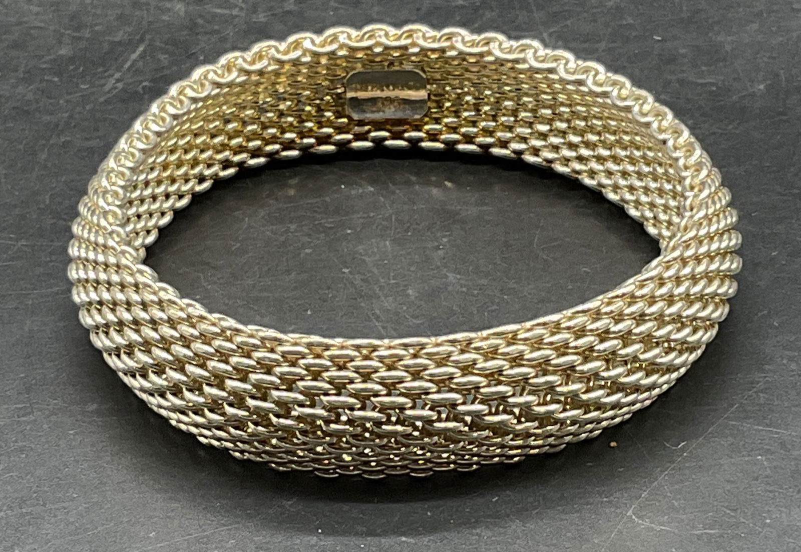 Tiffany & Co Sterling Silver Somerset Bracelet: Signed Tiffany & Co Somerset sterling silver mesh chain bangle bracelet. Marked sterling. Measures approx 2.5 inches wide. Total weight 59.3 grams. Some scratching. Jewelry, estate jewelry, fine jewel