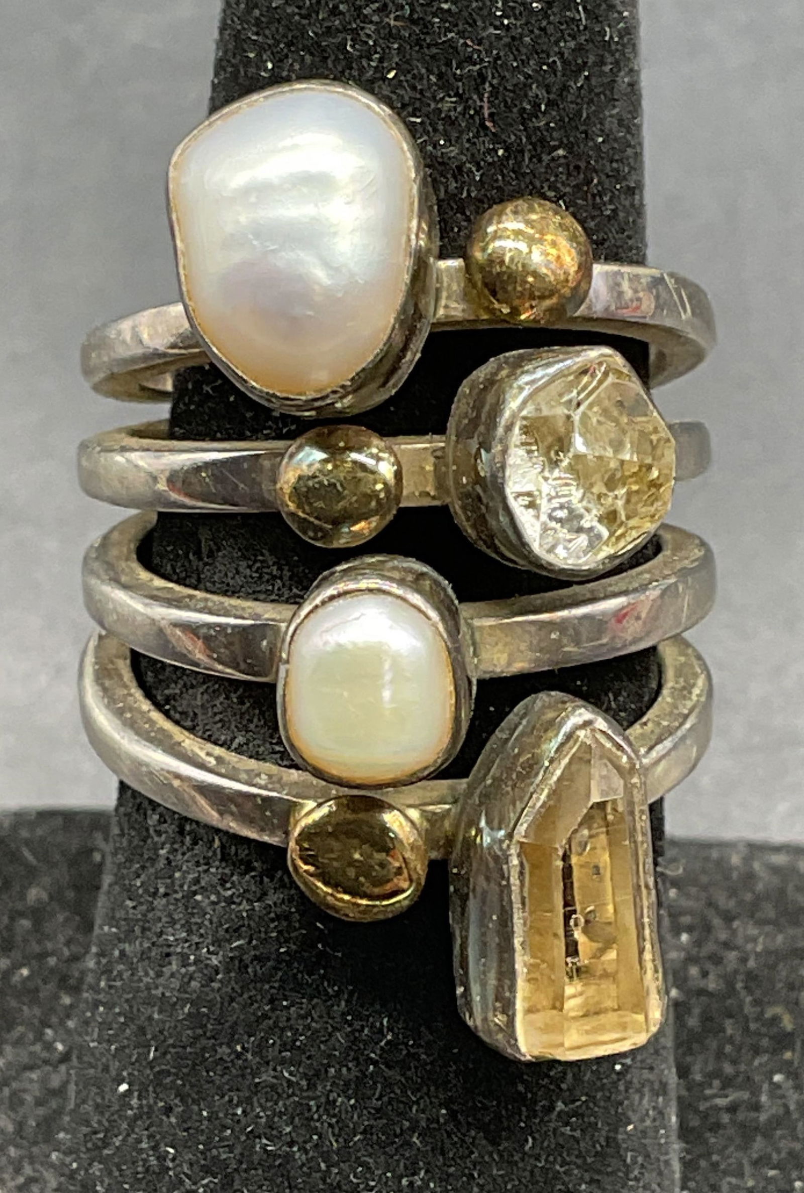 Lilly Barrack Sterling 14K Gold Semiprecious Ring: Signed Lilly Barrack sterling silver stacked band ring with 14k gold accents and semiprecious stones and pears. Ring size approx 7. Marked sterling and 14k. Total weight 12.8 grams. Some scratching. J