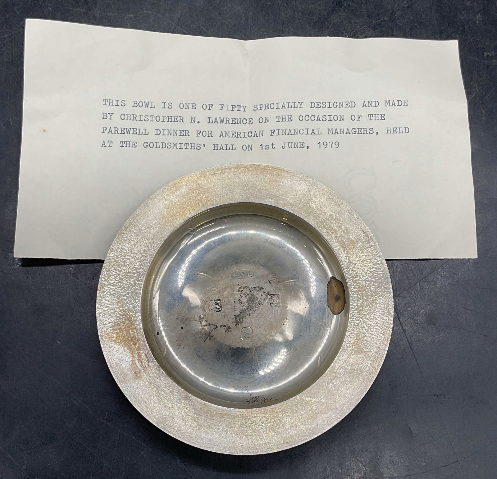 Christopher Lawrence Sterling Silver Bowl 117.2 G: Vintage 1979 Christopher N. Lawrence sterling silver modernist bowl. Textured rim and raised center. Signed CNL and stamped with hallmarks. Produced for American Financial Managers Farewell Dinner, Go