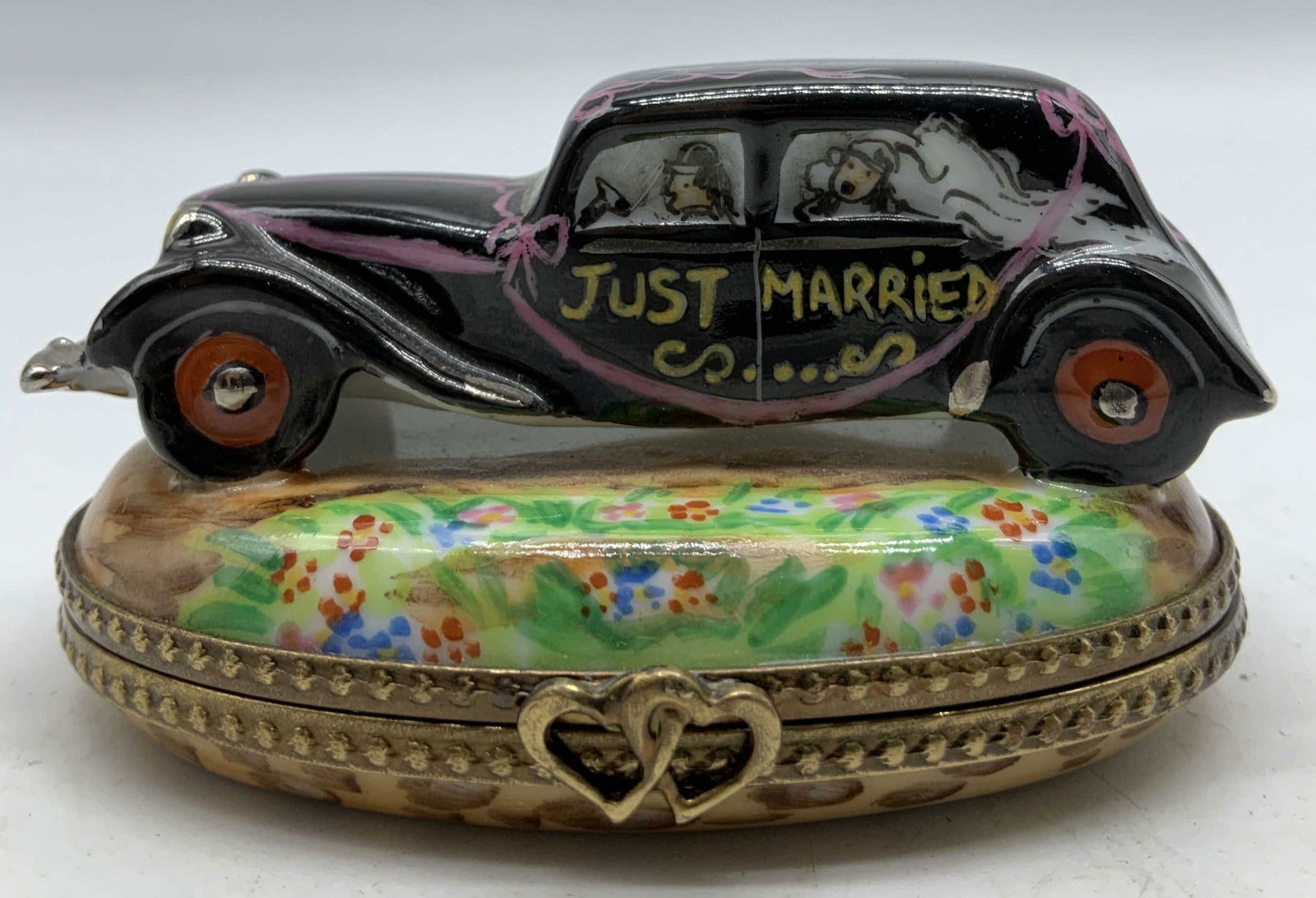 Limoges HndPainted Just Married Trink Box FRANCE: Limoges hand painted porcelain trinket box shaped like a classic black car with pink ribbons. Car reads, Just Married. Floral accents on base. Signed & marked on underside. Reads, L.J. Peint Main. Lim