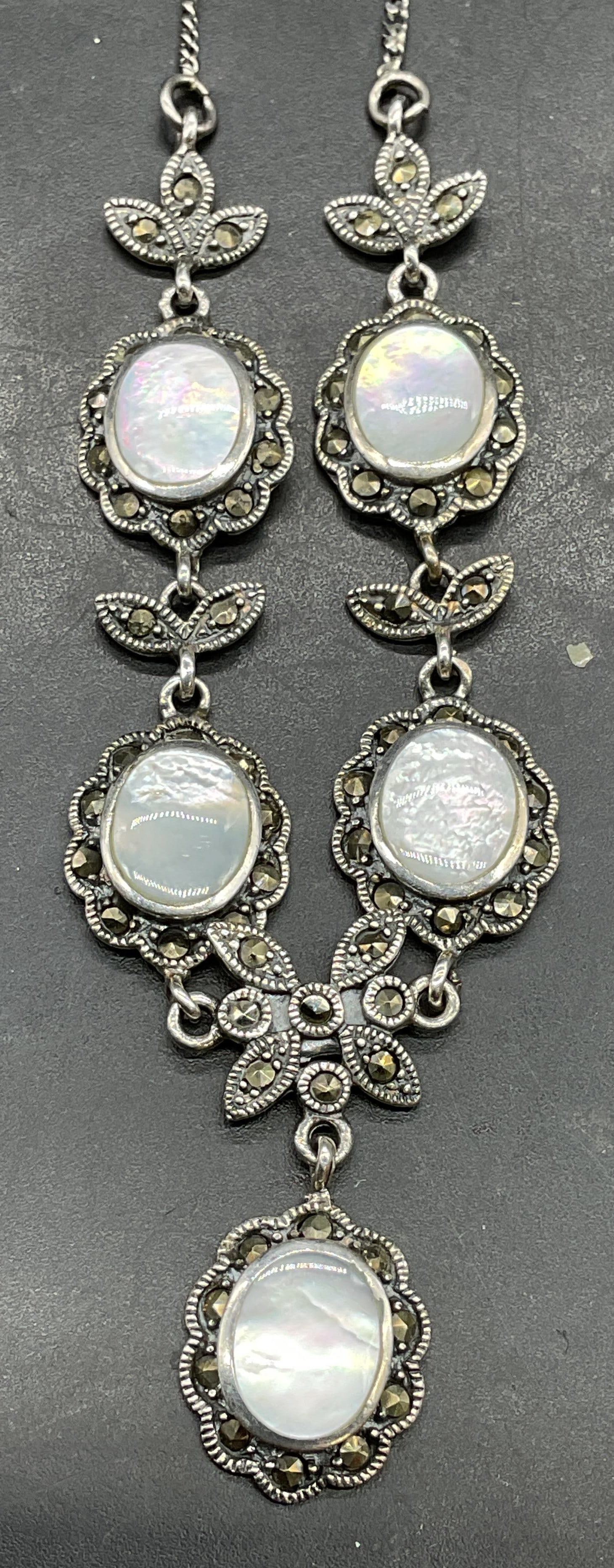 ATI Sterling Silver MOP Marcasite Necklace: Signed ATI sterling silver n necklace with mother of pearl and marcasite. Drop length approx 8.75 inches. Marked sterling. Total weight 10.9 grams. Some scratching. Jewelry, estate jewelry, fine