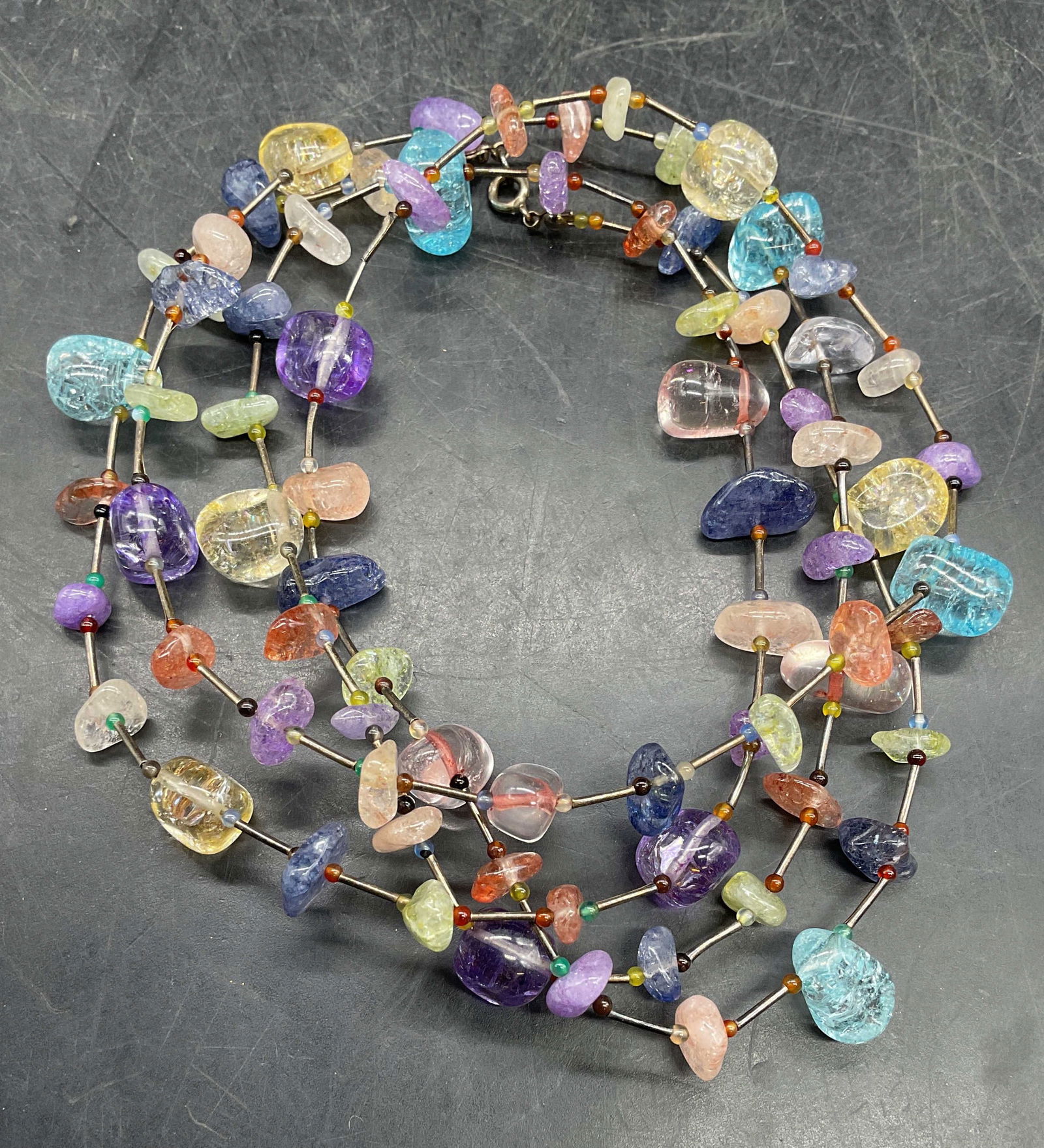 Sterling Silver Semiprecious Beaded Necklace: Sterling silver necklace its multicolor semiprecious stone beads. Drop length approx 23 inches. Marked sterling. Total weight 72 grams. Some scratching. Jewelry, estate jewelry, fine jewelry,