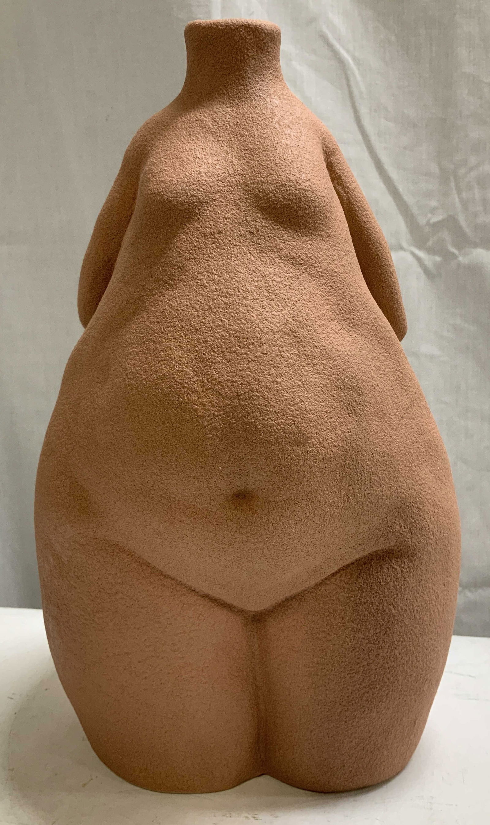 Bloomingville Feminine Body Stoneware Vessel: Bloomingville feminine body figure vessel features a textured finish. Visible curves & arm accents. Appears to be possible stoneware material. Signed & marked on underside. Reads, BLOOMINGVILLE. Surfa