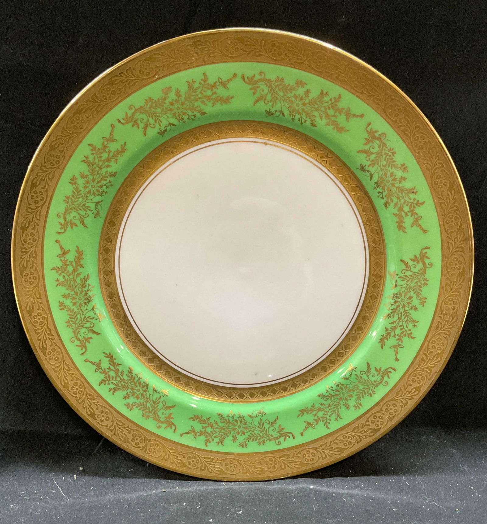 Vtg Puls Czechoslovakia Gilt Porcelain Plate: Vintage, possibly antique, Puls porcelain plate. Le Roy pattern. Ornate gilt scroll decoration and borders with green inner rim. Signed. Made in Czechoslovakia. Measures approx 11 inches wide.