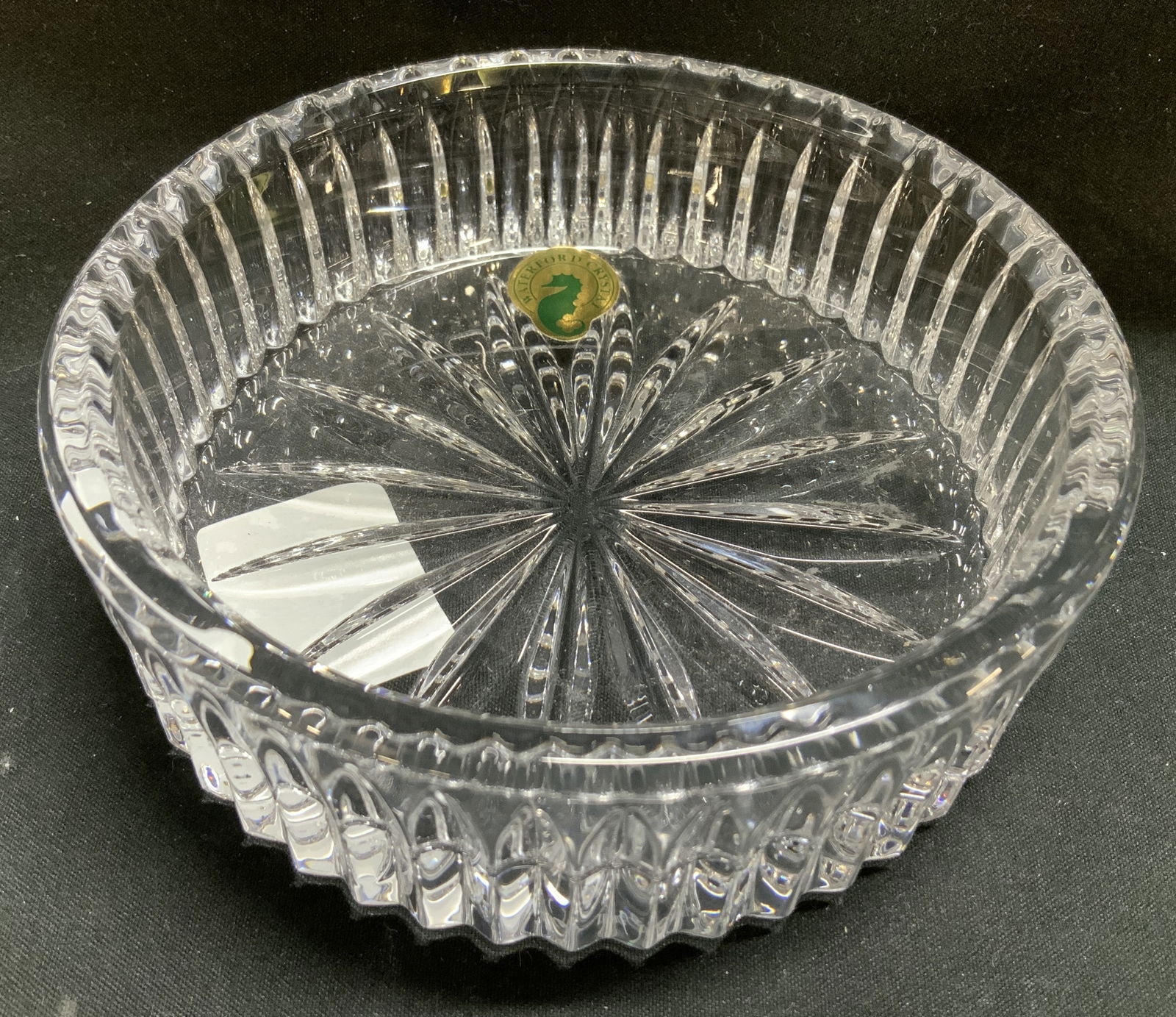 Waterford Crystal Heritage Wine Coaster SLOVENIA: Waterford heritage wine coaster features a decorative vertical cut pattern on sides. Coaster is clear crystal material. Signed & marked on underside. Reads, HERITAGE WINE COASTER. MADE IN SLOVENIA. WA