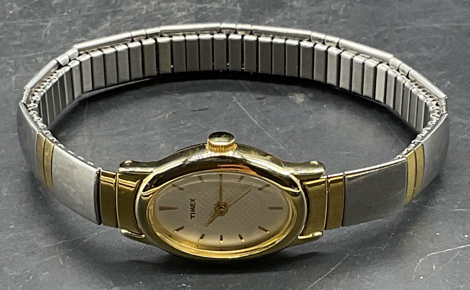 Timex Silver Gold Tone Bracelet Watch: Signed Timex silver and gold tone stretch bracelet band wristwatch. Measure approx 2.25 inches wide. Not tested. Some scratching. Jewelry, estate jewelry, costume jewelry, cocktail jewelry, fashion je