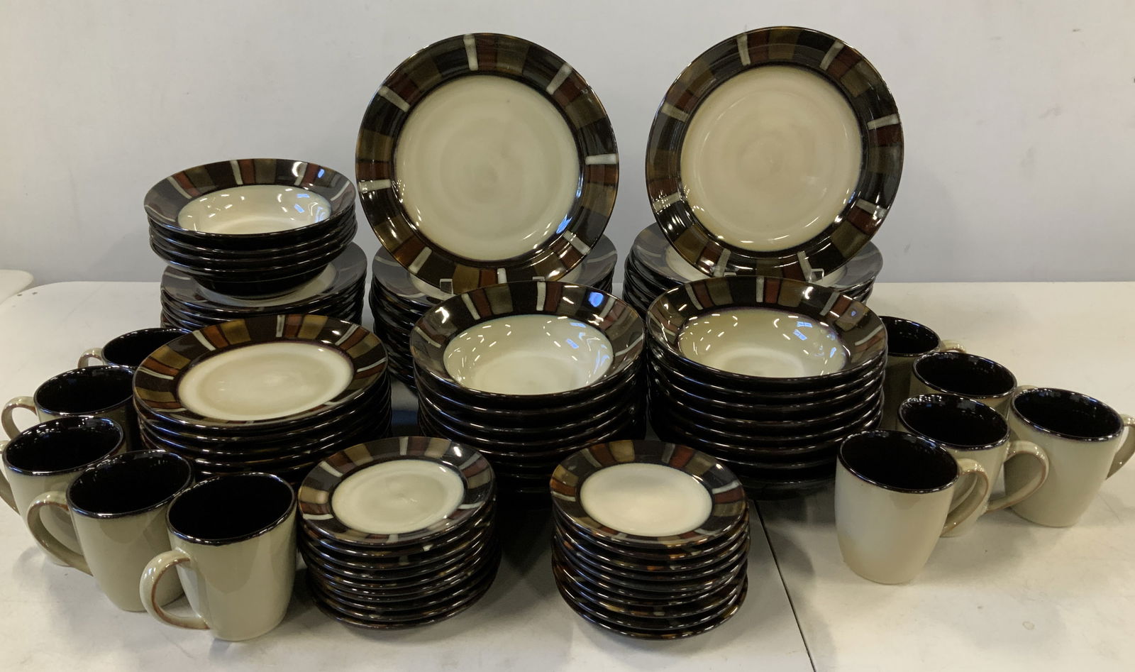 Set 90 Gourmet Basics By Mikasa Tableware: Lot includes, 10 mugs, 20 dinner plates, 20 salad plates, 20 bowls, 20 butter plates. Pieces are stoneware material & feature a distinctive pattern on rim. Signed & marked on underside. Reads, GOURMET