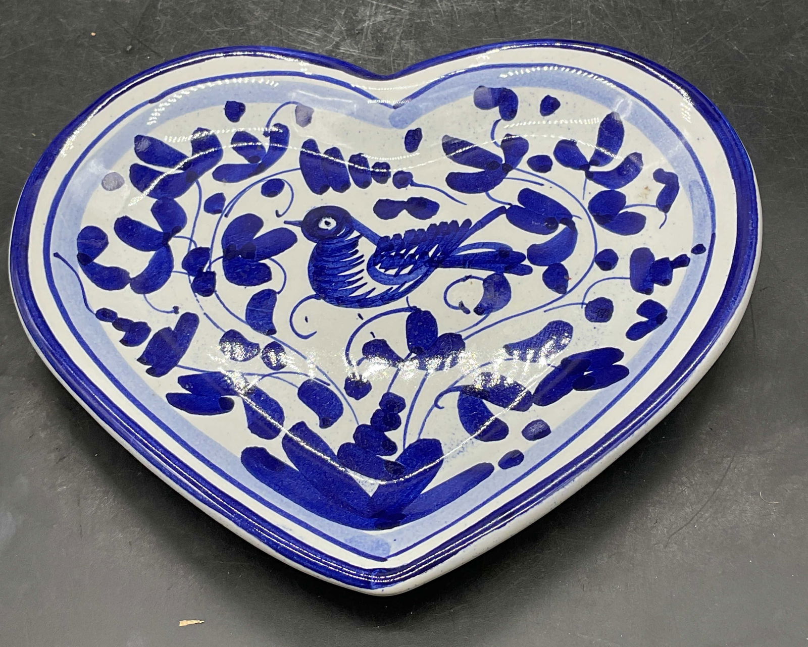 SM Blue & White Ceramic Heart Bird Dish, Italy: Signed SM hand painted blue and white ceramic heart shaped with bird design. Measures approx 6.5 x 5.5 inches. Made in Italy. Some scratching. Heart dish, bird dish, ceramic dish, home decor, home acc