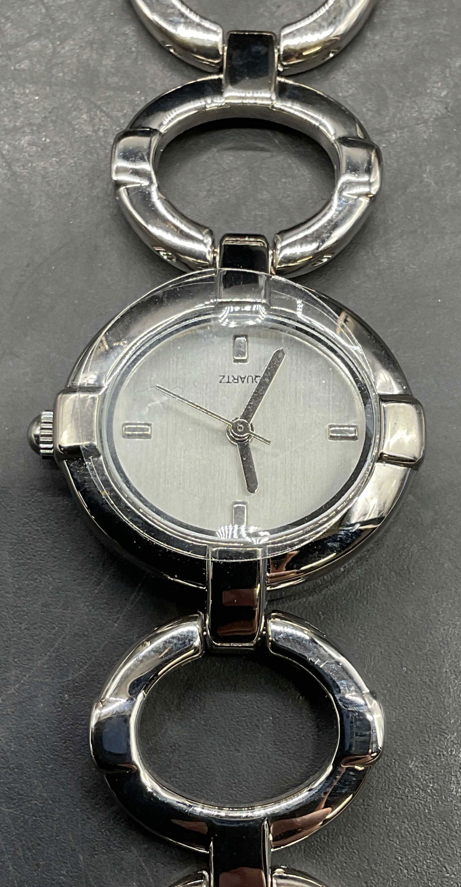 Stainless Steel Bracelet Chain Wristwatch: Stainless steel open circle bracelet chain watch. Measures approx 7.5 inches long. Not tested. Some scratching. Jewelry, estate jewelry, costume jewelry, cocktail jewelry, fashion jewelry, accessories