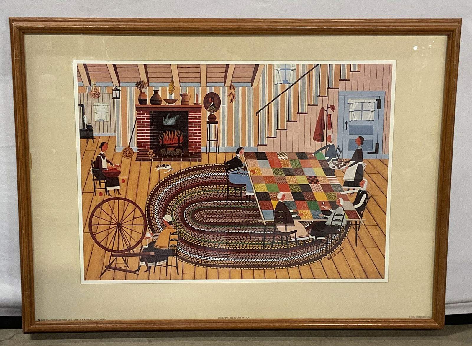 Framed Leo Bryant Folk Art Quilting Lithograph 29i: Framed lithograph poster. After Leo Bryant, Quilting Bee. Folk art scene. Published by Portal Publications. Wood frame. Not examined out of frame. Frame measures approx 21.25 x 29.75 inches. Some wear