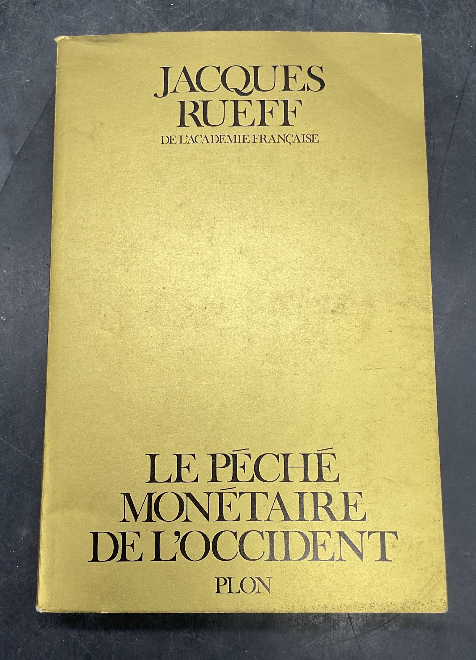 Signed Jacques Rueff Le Peche Monetaire: Softcover copy of Le Peche Monetaire De L Occident by Jacques Rueff. Signed and inscribed by the author in ink or title page. Published by Plon, 1971. Measures approx 8 x 5.25 inches. Wear to cover, p