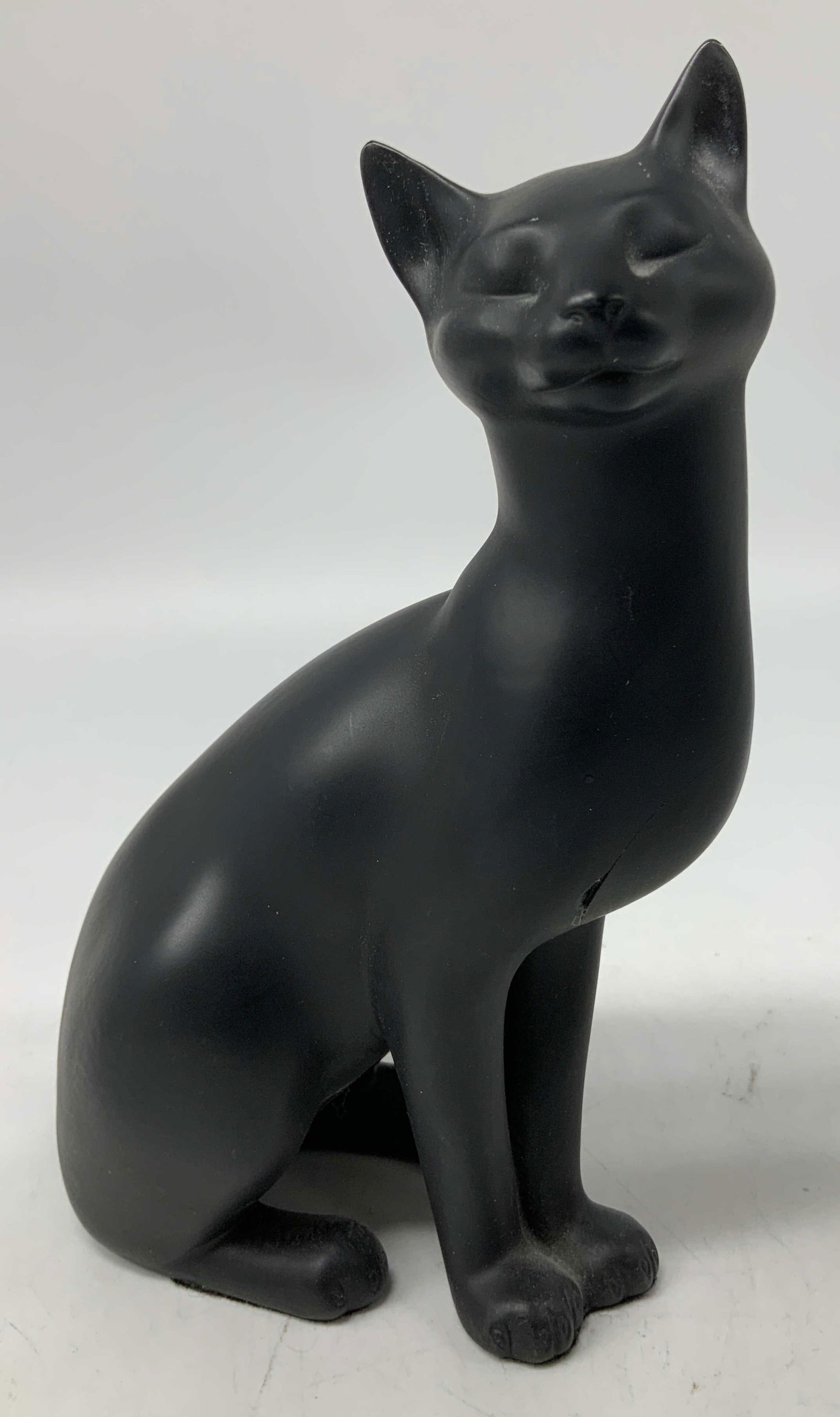 1986 The Franklin Mint Counterpoint Cat Figurine: Cat figurine is crafted from black porcelain & features a matte finish. Cat is in a sitting position w its eye closed. Signed & marked on underside. Reads, COUNTERPOINT. 1986 THE FRANKLIN MINT. Surfac