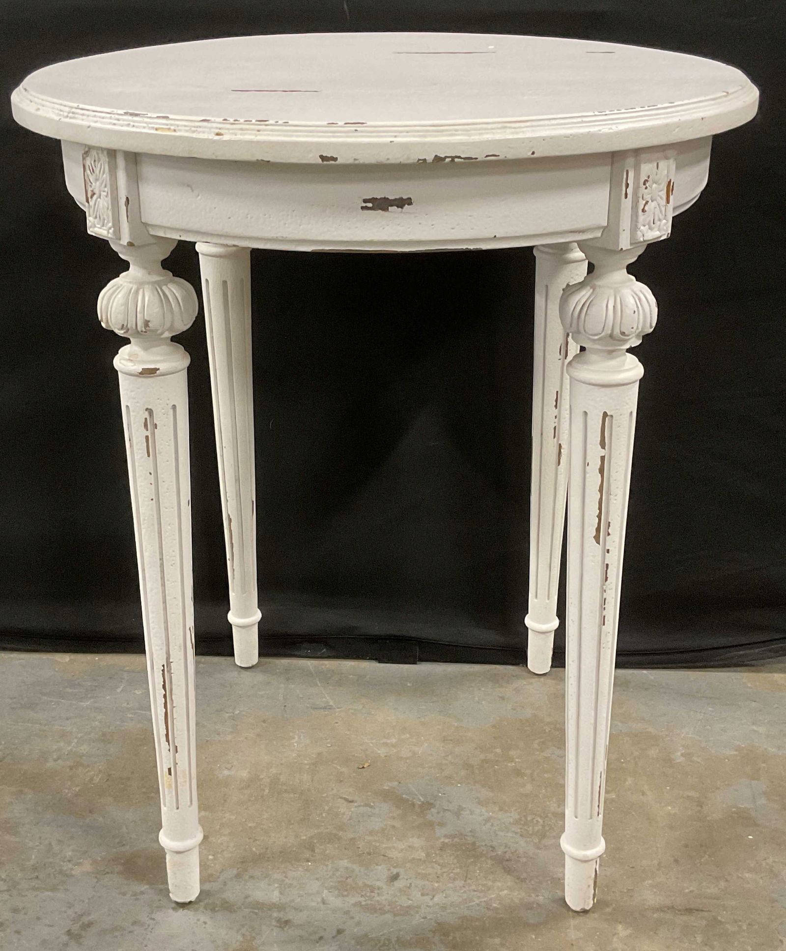 Vintage White Wood Carved Leg Side Table: Vintage white painted wood round side table with decorative carved legs. Measures approx 25 x 29.5 inches. Wear including scratching and loss to paint. Table, white table, side table, accent table, fu