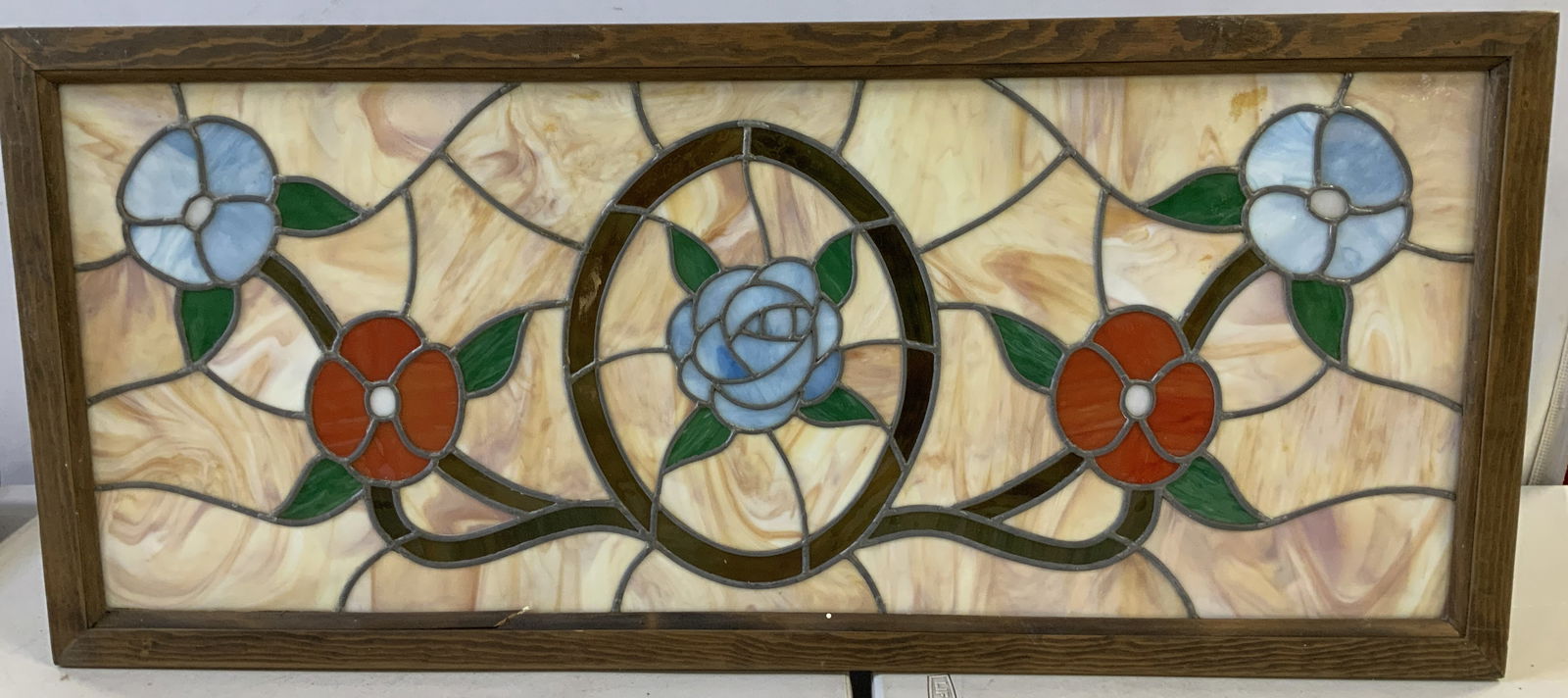 Vtg Stained Glass Floral Panel Light Fixture 40in: Vintage rectangular stained glass panel featuring a floral design with red & blue flowers. Oval central motif. Piece is set within a wooden frame. Signed & marked on underside. Reads, MERCURY LIGHTING