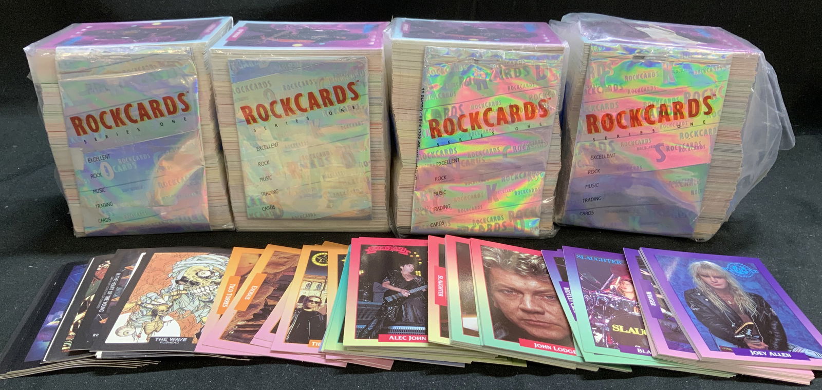 Lot 100+ 1991 Brockum Rock Music Trading Cards: Lot includes, 100+ 1991 Brockum Rock Cards. Copyright 1991. Captain Kidd Clothes Inc. Music trading cards feature various rockstars. Has not been inspected individually. Lot is sold as is. Surface wea