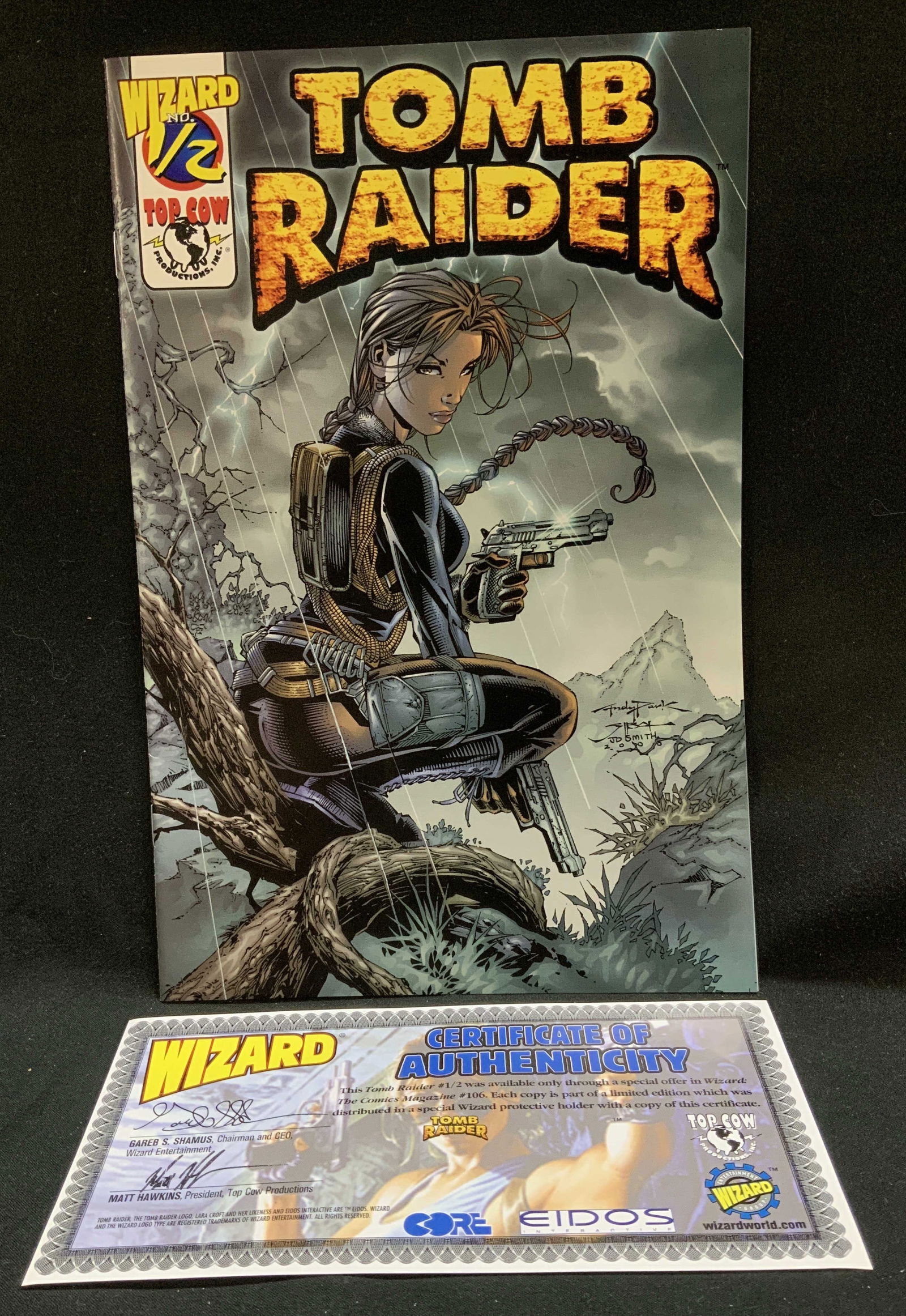 2000 Limit Ed Tomb Raider Wizard #1/2 Comic Bk: Lot includes, 2000 limited edition(first printing) Tomb Raider #1/2 comic book from Top Cow/Wizard. Comes with a Certificate of Authenticity. Tomb Raider #1/2 was available only through a special offe