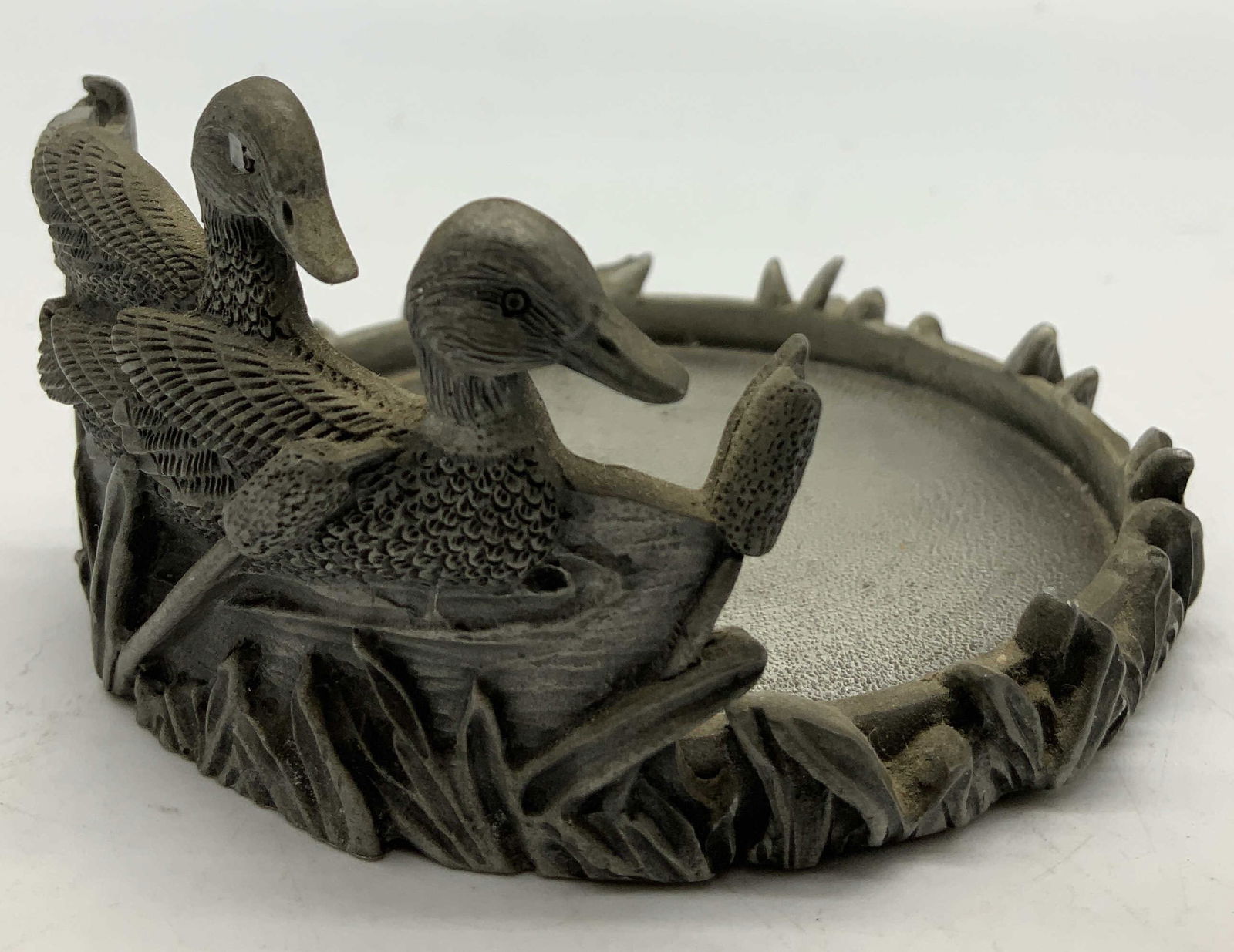 Vntg Swimming Ducks Pewter Candle Holder: Vintage pewter candle holder features 2 swimming ducks & a base of cattails. No visible signature or markings. Surface wear consistent to age, use & exposure. Measurements: length 3.6in x width 3.6in