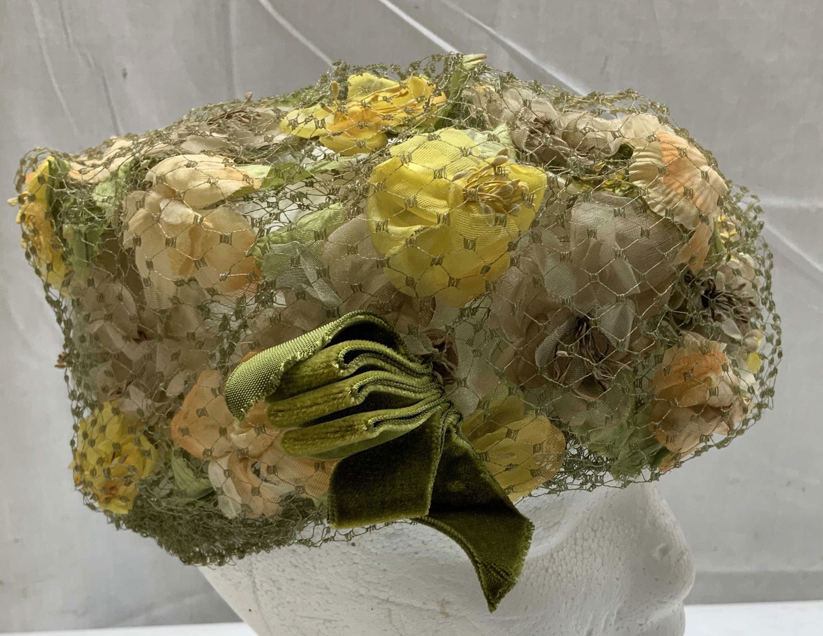 Vtg Best & Co. Fifth Ave Floral Pillbox Hat NY: Vintage Best & Co. fifth Avenue floral pillbox style hat features an olive green mesh & floral accents. Velvet accent. Fabric & mesh material. Signed & marked. Reads, BEST & CO. FIFTH AVE. NEW YORK. S