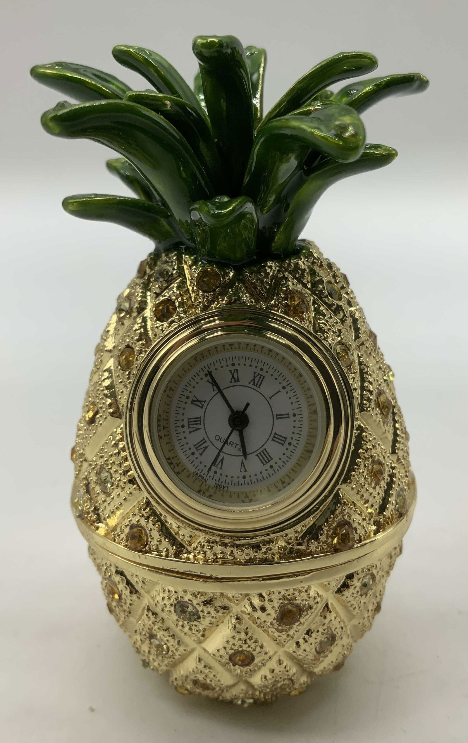 Enameled Pineapple Trnk Box W Quartz Clock JAPAN: Enameled metal trinket box shaped like a pineapple & features a Quartz clock with Roman numerals. Yellow rhinestone accents on body. Surface wear consistent to age, use & exposure. Signed & marked. Re