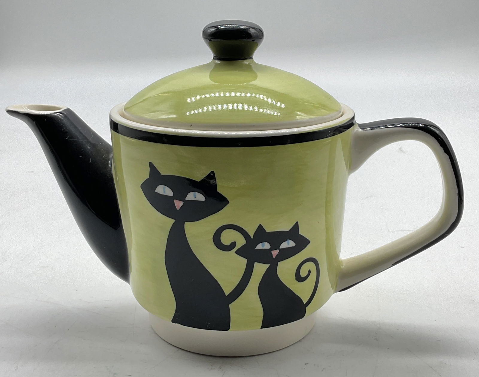 Hues N Brews Hand Painted Ceramic Teapot W Lid: Hues N Brews hand painted ceramic teapot. Comes with lid. Underside is marked, reads as follows color coordinates for coffee & tea Hues N Brews Microwave & Dishwasher Safe Made In Thailand. Hand paint