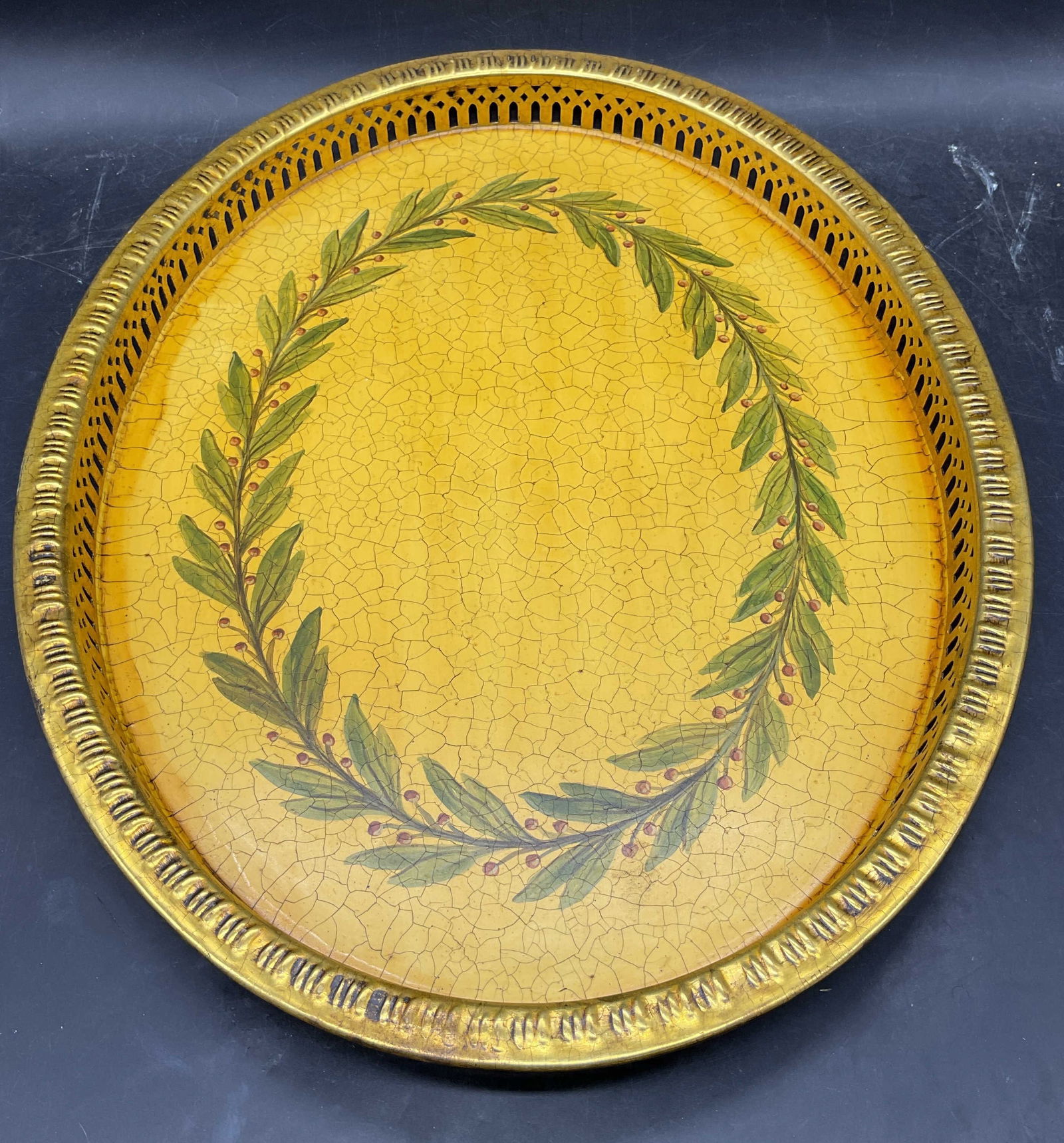 Brass Hand Painted Laurel Vanity Tray: Brass vanity tray. Reticulated rim. Hand painted Lauren design with crackle. Measures approx 17.5 x 13.5 x 1.25 inches. Some wear including scratching. Vanity tray, brass tray, laurel tray, home decor