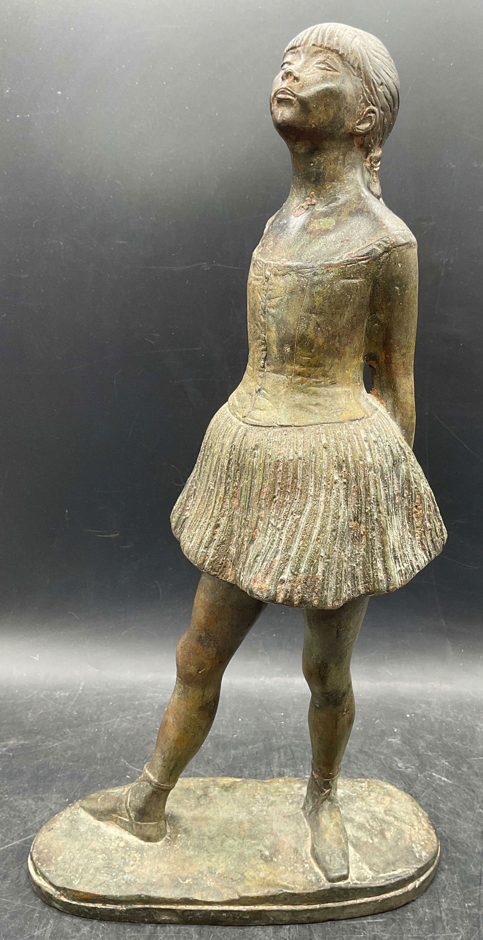 After Degas Cast Bronze Little Dancer Sculpture: After Edgar Degas cast bronze sculpture. Little Dancer, Aged Fourteen. Measures approx 8.75 x 4 x 16.5 inches. Wear including patina. Sculpture has significant weight. After Edgar degas, dancer sculpt