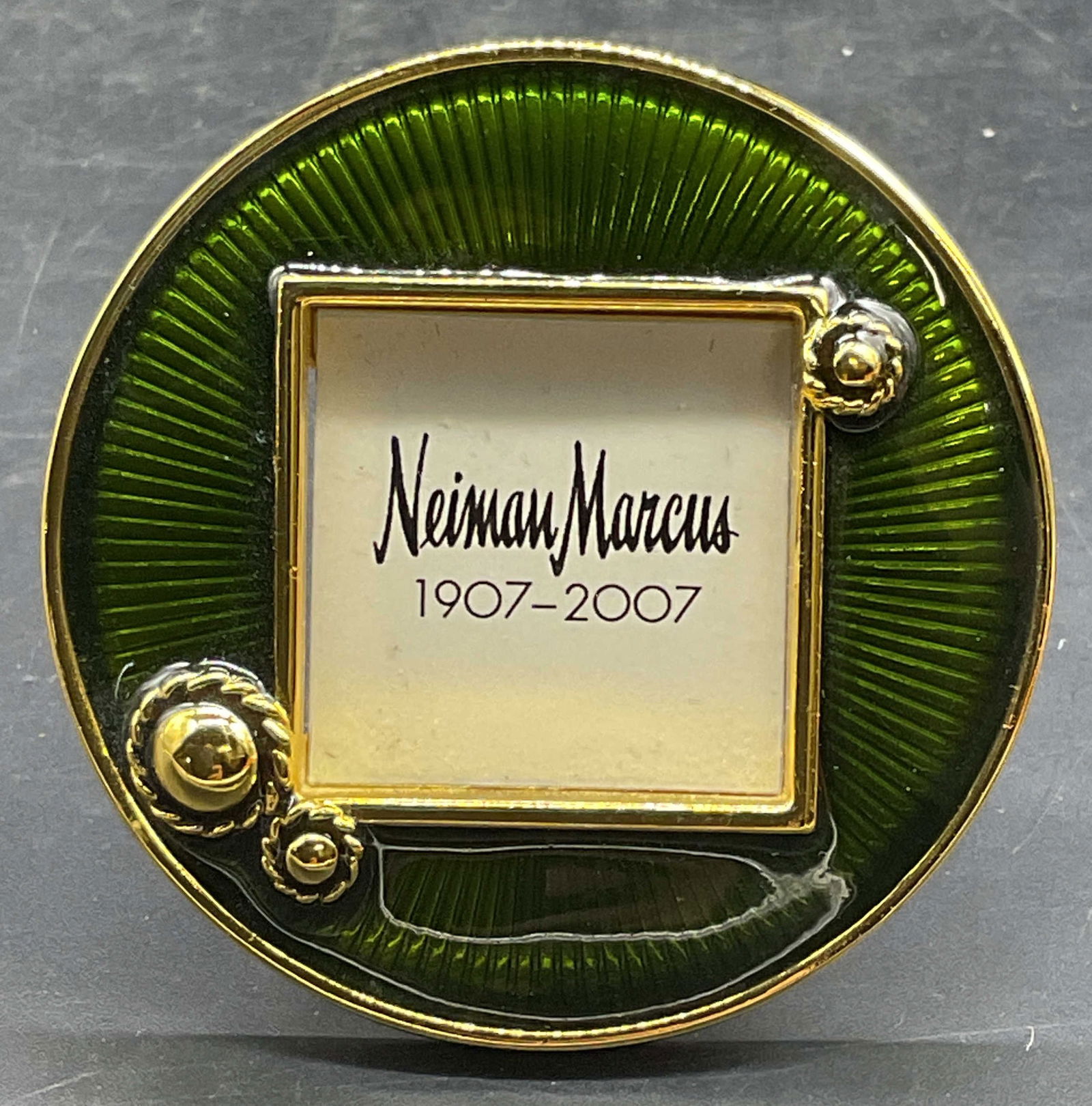 Jay Strongwater Green Enamel Picture Frame NWOT: Signed Jay Strongwater round gold tone miniature picture frame with green enamel. Easel backing with clip. New without tag. Measures approx 2 inches wide. Jay Strongwater picture frame, green picture