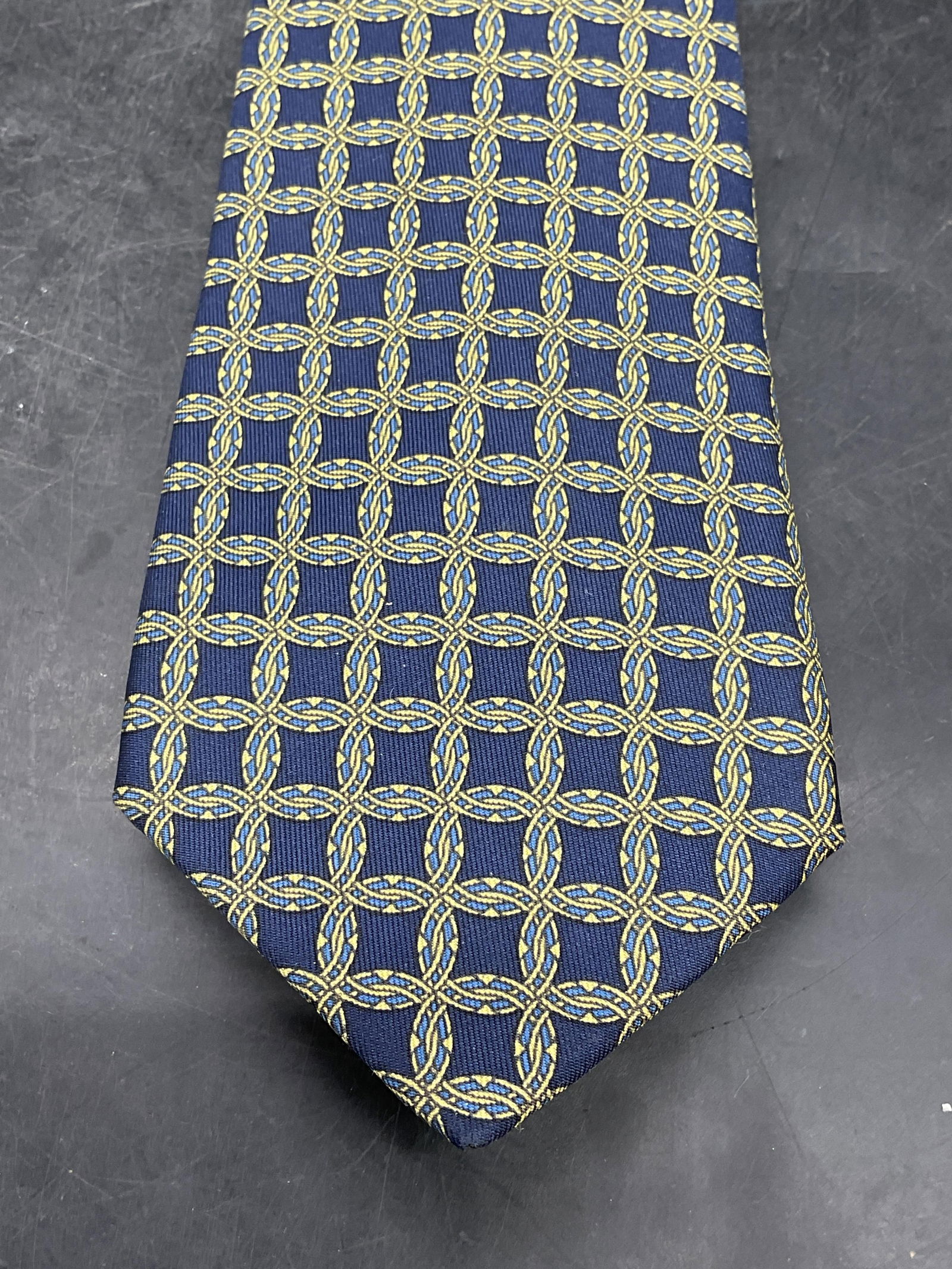 Hermes Blue & Yellow Geometric Silk Tie, France: Signed Hermes blue and yellow geometric print silk tie. Made in France. Measures approx 54 inches. Additional Neiman Marcus label. Some wear consistent with exposure. Hermes, Hermes tie, luxury tie, s