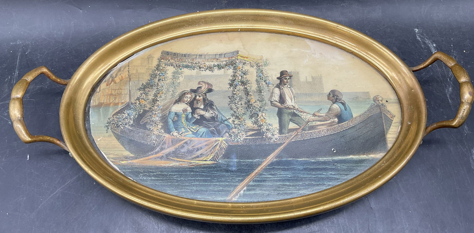 Antique French Brass Max Beeger Litho Tray: Antique French tray with hand colored lithograph. Print after Max Beeger (19th century). Brass frame with handles. Glass over print. Measures approx 14 x 7.75 x 2 inches. Labeled Republique Francaise