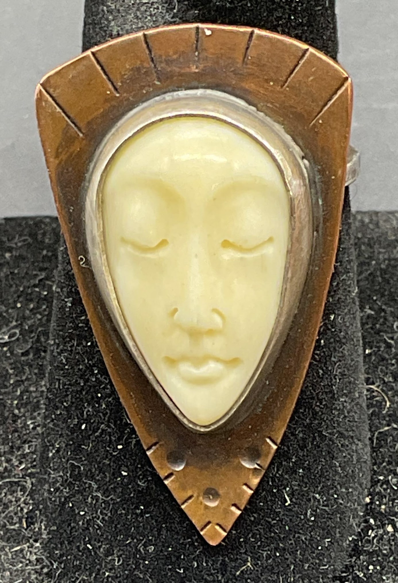 Signed Sterling Silver Carved Face Ring: Signed Sterling silver and copper ring with carved white face. Tested for sterling. Ring size 7.5. Total weight 6.9 grams. Signed illegibly, possibly Anok. Some scratching. Jewelry, estate jewelry, fi