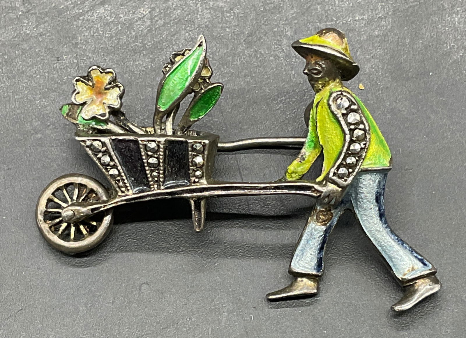 835 Silver Figural Wheelbarrow Brooch: Vintage 835 silver figural and wheelbarrow motif brooch with enamel and marcasite decoration. Measures approx 1.5 x 1 inches. Marked 835. Total weight 6.6 grams. Some scratching. Jewelry, estate jewel