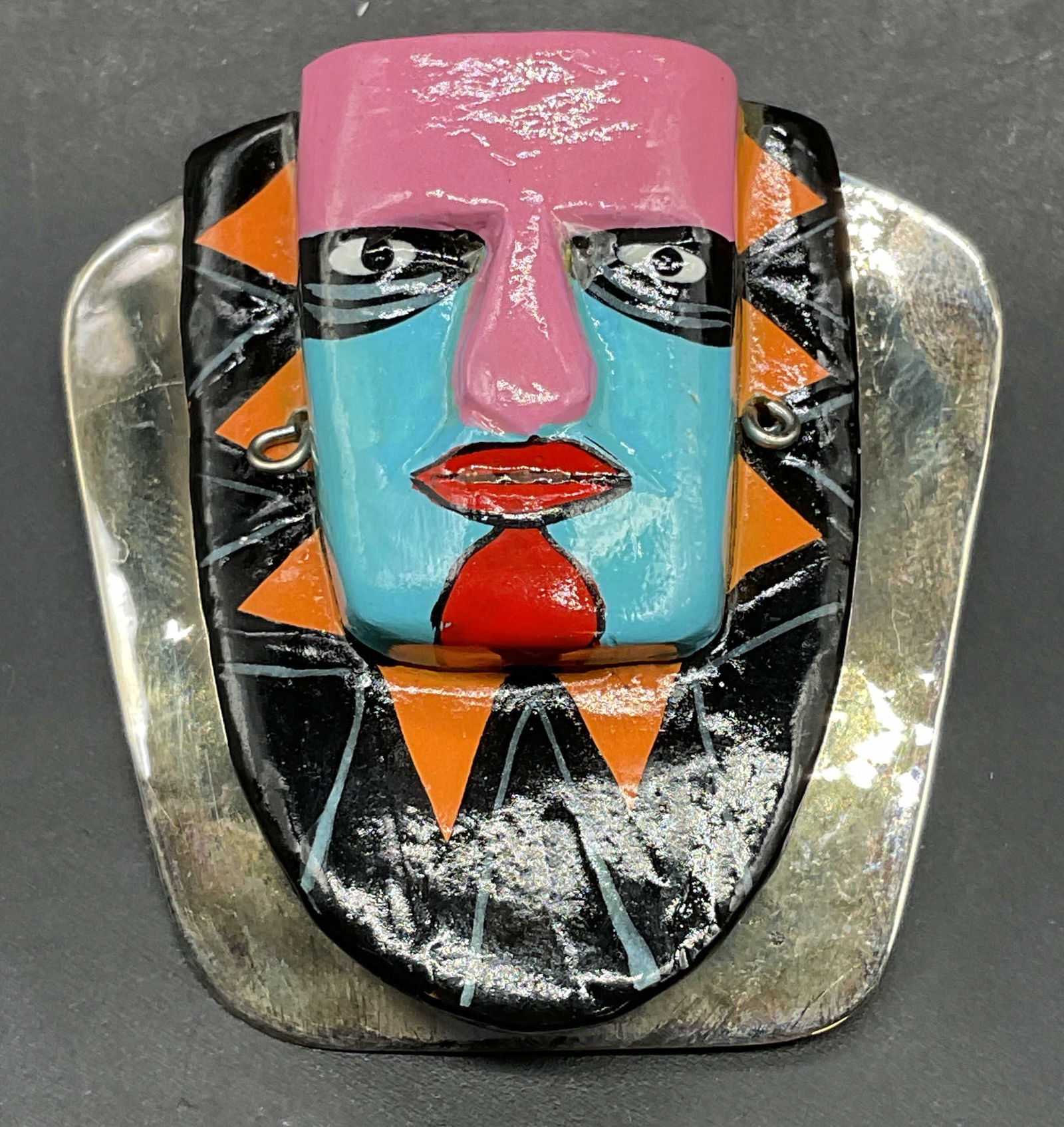 Handmade Abstract Tribal Face Brooch: Handmade brooch with abstract tribal style face and silver tone back. Measures approx 1.75 x 1.75 inches. Some scratching. Jewelry, estate jewelry, costume jewelry, cocktail jewelry, fashion jewelry,