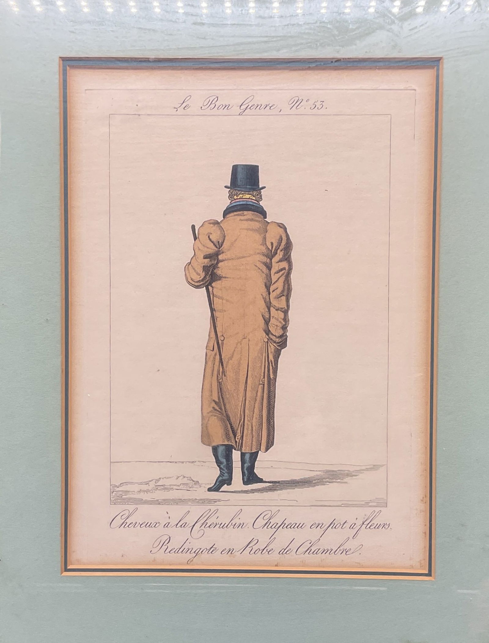 Antq Le Bon Genre French Fashion Engraving: Framed and matted hand colored engraving on paper. From Le Bon Genre, no. 53. French satirical fashion print. Man wearing hat and coat. Published circa early 19th century. Wood frame. Not