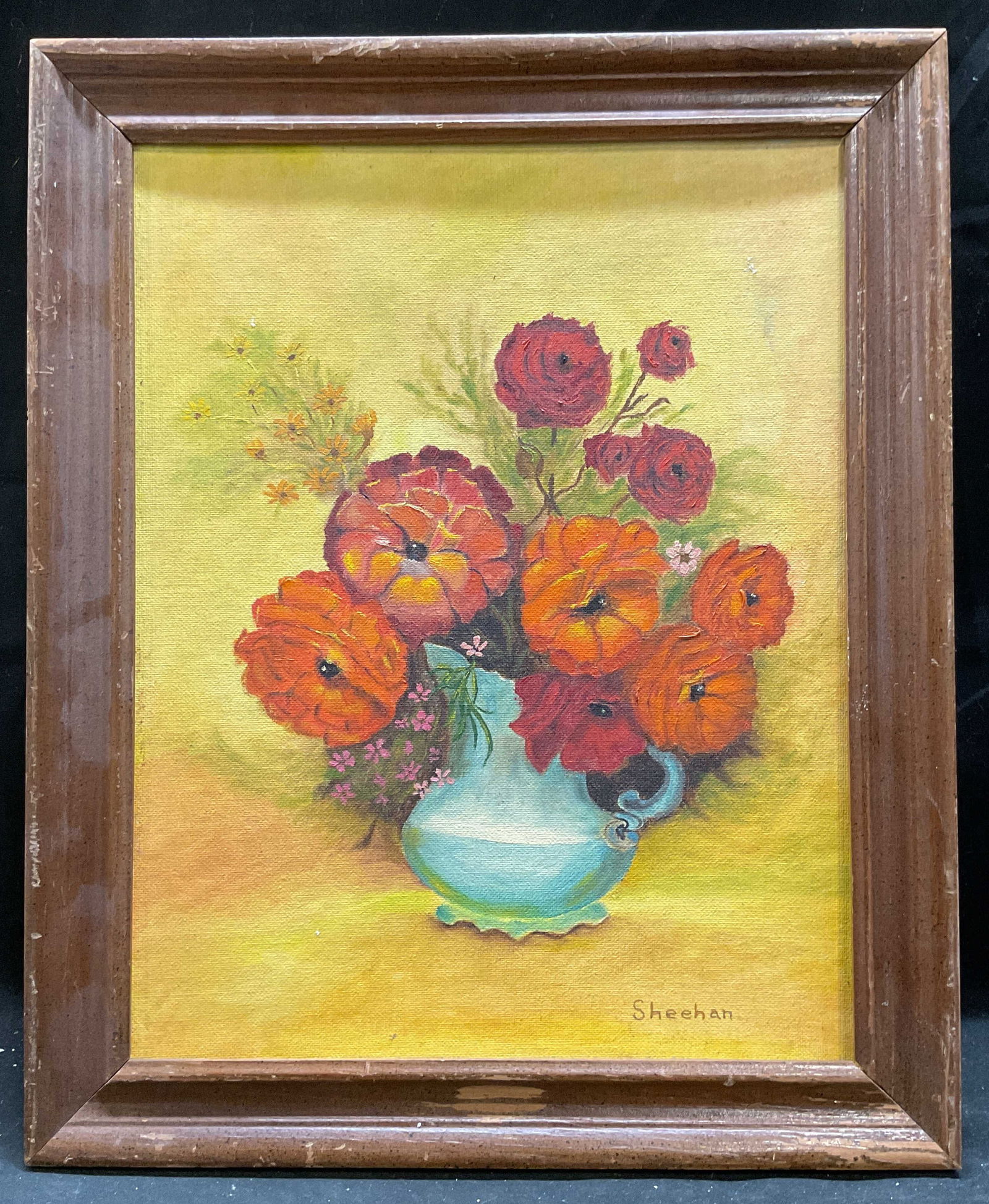 Signed Sheehan Still Life Flowers Oil Painting: Framed oil on canvas board painting. Signed lower right, Sheehan. Still life with flowers in orange, red, and yellow. Wood frame. Not examined out of frame. Frame measures approx 16.5 x 13.5 inches. S