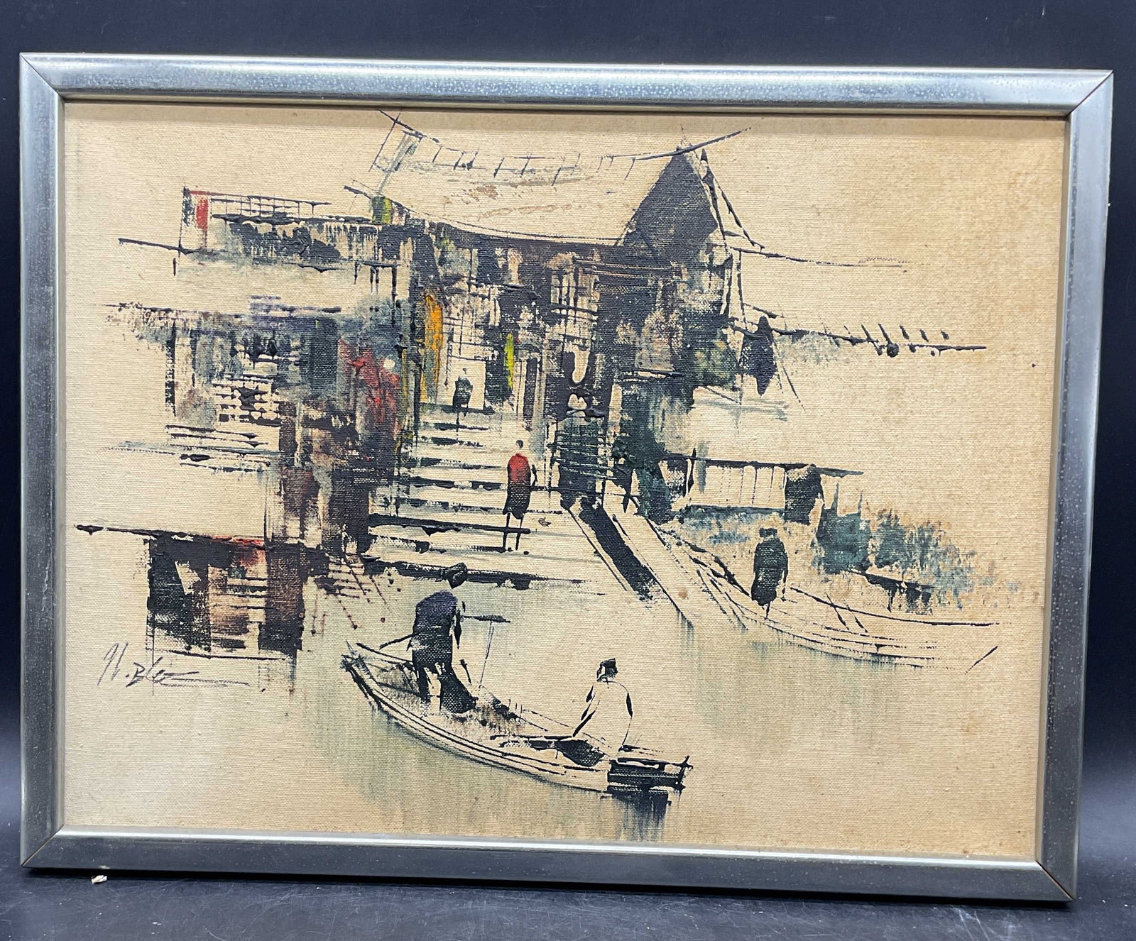 Mid Cen Signed Chinese Village Scene Painting: Framed mid 20th century style painting on canvas. Medium unknown, possibly oil or mixed media. Signed lower left, illegible. Chinese village scene with stylized figures, boats, and architecture. Silve