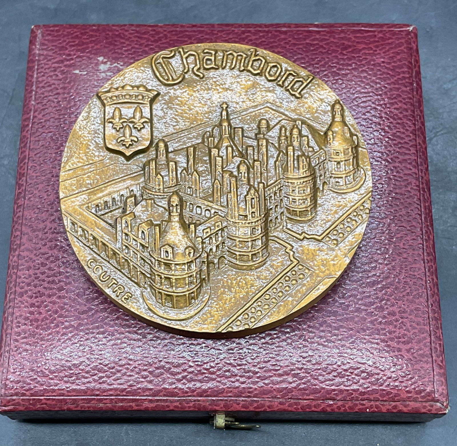 1968 Chateau Chambord Bronze Medal, France: Vintage 1968 commemorative bronze medal. Chateau de Chambord. Dragon on reverse. Made in France. Modeled by Coutre. Measures approx. 2 3/8 inches wide. includes display case. Some wear consistent with