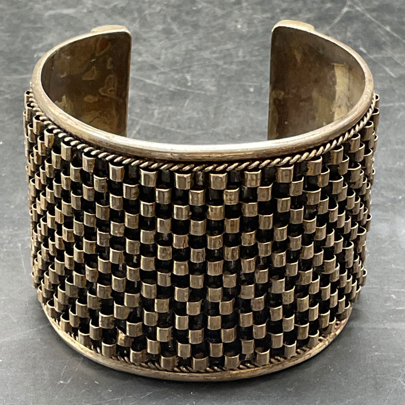 Vintage Sterling Silver Woven Cuff Bracelet: Vintage sterling silver wide band cuff bracelet with woven style wave band. Marked sterling. Measures approx. 2.5 inches wide. Total weight 73.3 grams. Some scratching. Jewelry, estate jewelry,