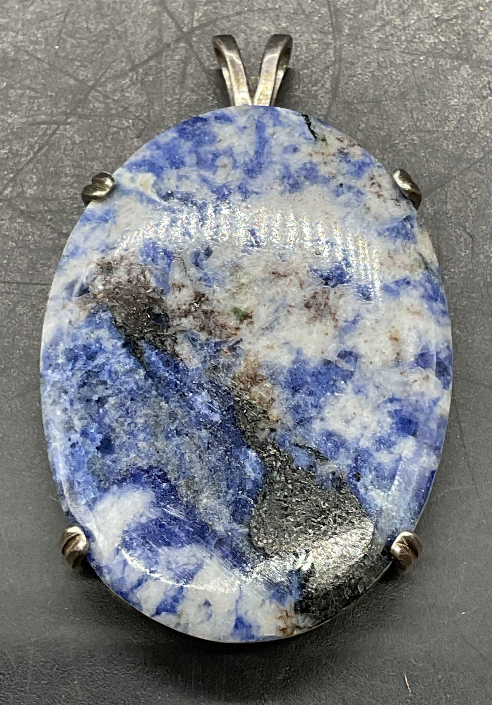 Vintage Sterling Silver Sodalite Pendant: Vintage sterling pendant with sodalite cabochon. Measures approx. 1.5 x 1.25 inches. Tested for sterling. Total weight 14 grams. Some scratching. Jewelry, estate jewelry, fine jewelry, cocktail