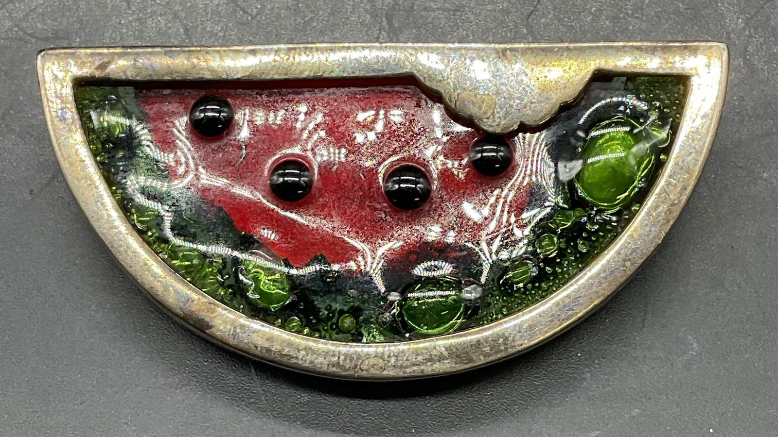 Sterling Silver Art Glass Watermelon Brooch: Vintage art glass watermelon brooch with sterling silver setting. Marked sterling. Measures approx. 1 x 2.25 inches. Total weight 21.9 grams. Some scratching. Jewelry, estate jewelry, costume jewelry,