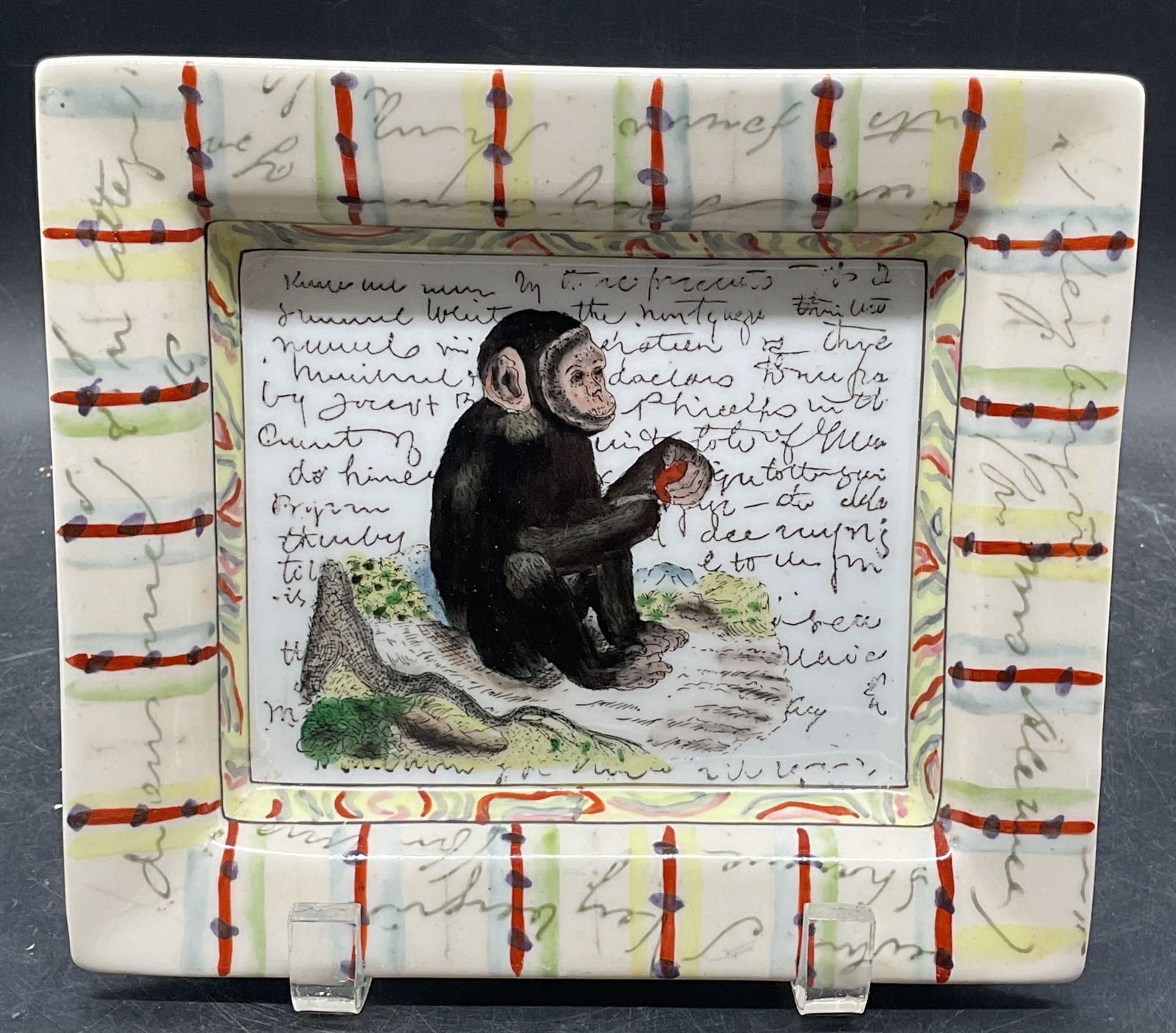 John DERIAN Hand Painted Porcelain Monkey Plate: Signed John DERIAN for Tozai Home hand painted porcelain rectangular plate with monkey motif. Measures approx. 7.75 x 6.75 inches. Plate has weight. Some scratching. John DERIAN plate, porcelain