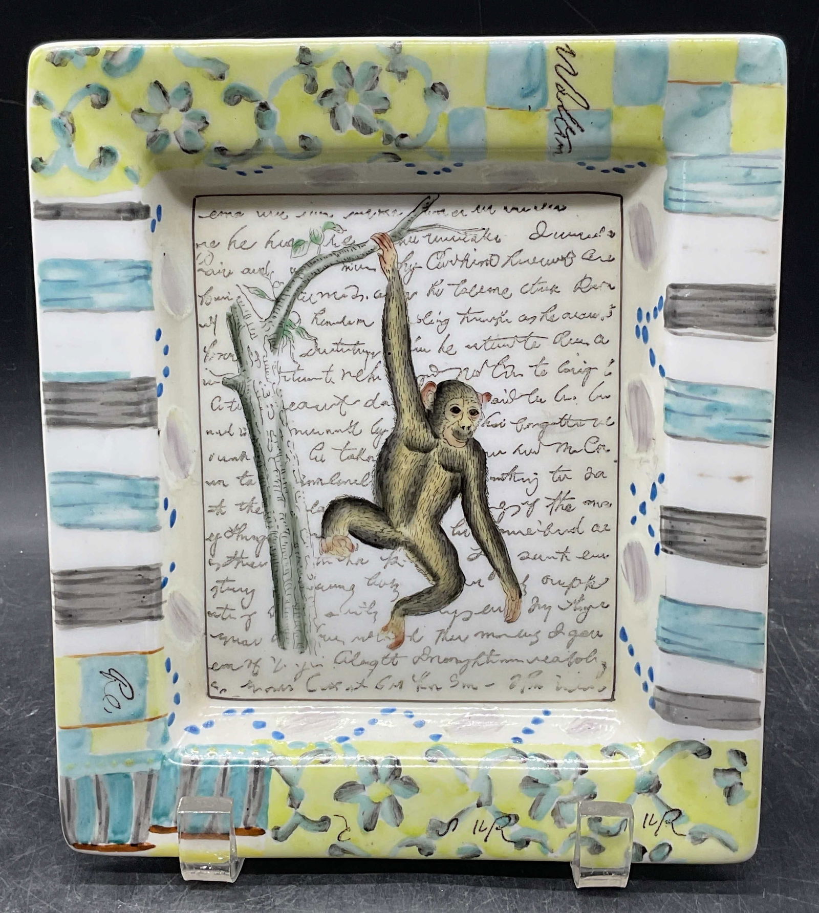 John DERIAN Hand Painted Monkey Porcelain Plate: Signed John DERIAN for Tozai Home hand painted porcelain rectangular plate with monkey motif. Measures approx. 7.75 x 6.75 inches. Plate has weight. Some scratching. John DERIAN plate, porcelain