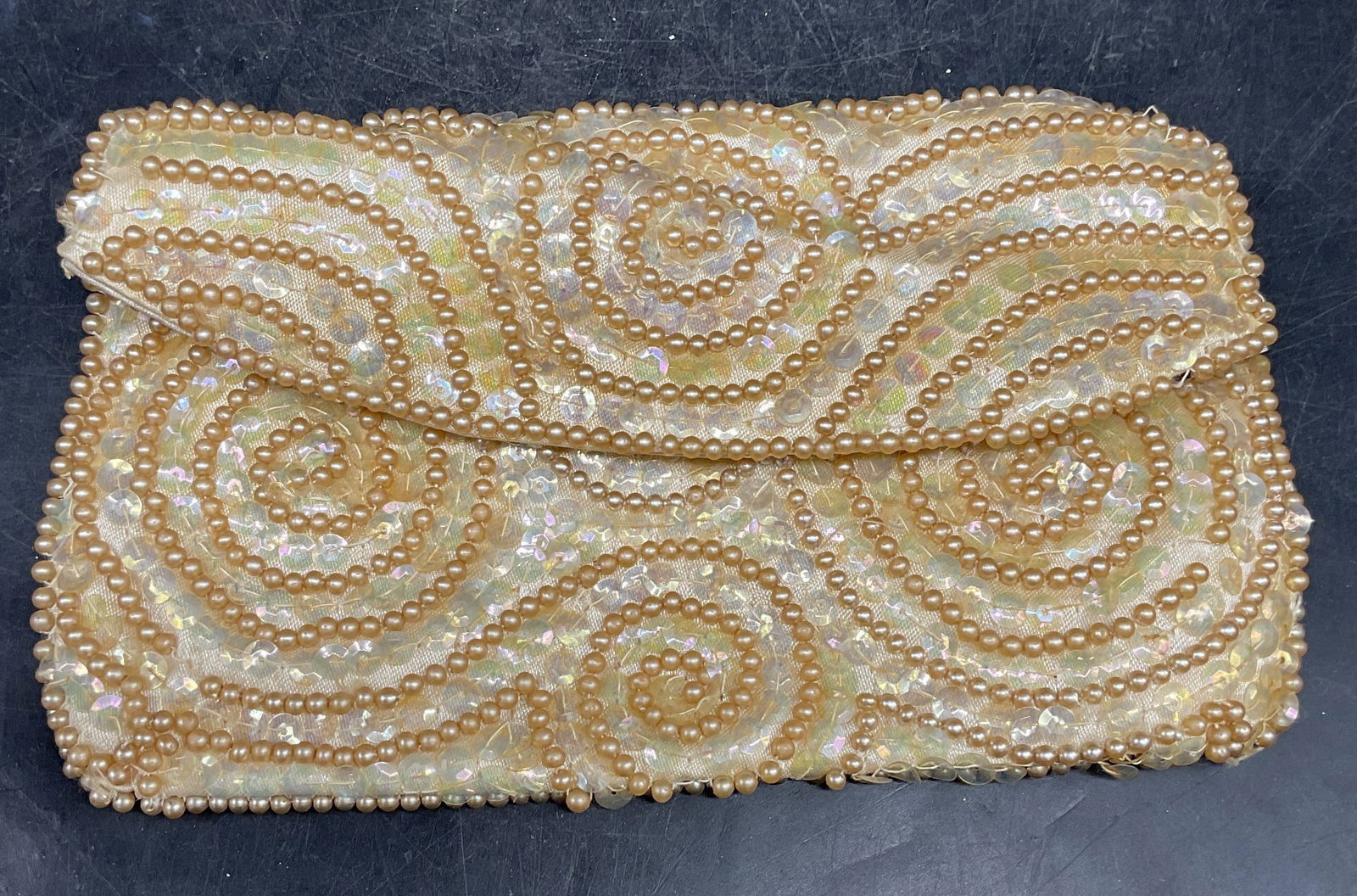 Vintage NKK Faux Pearl Beaded Handbag: Vintage NKK faux pearl and sequin beaded satin clutch handbag. Satin lined interior with slip pocket. Measures approx. 4.25 x 8 inches. Wear including discoloration and some losses to beads. Property