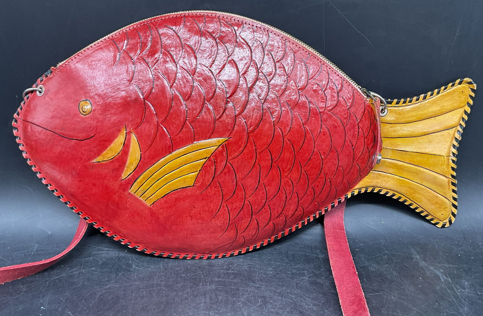 Vintage Red Leather Fish Handbag: Vintage red leather fish motif handbag. Measures approx. 8.5 x 15.5 inches. Some wear consistent with exposure. Fish handbag, leather handbag, red handbag, accessories, fashion accessories, wearables,
