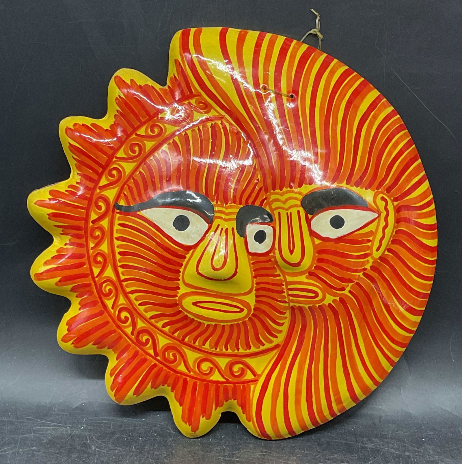 Hand Painted Sun & Moon Ceramic Wall Plaque: Handmade and hand painted sun and moon motif wall plaque in yellow and orange. Measures approx. 9.75 x 9.5 inches. Some scratching. Ceramic plaque, ceramic sun, ceramic moon, sun plaque, moon plaque,