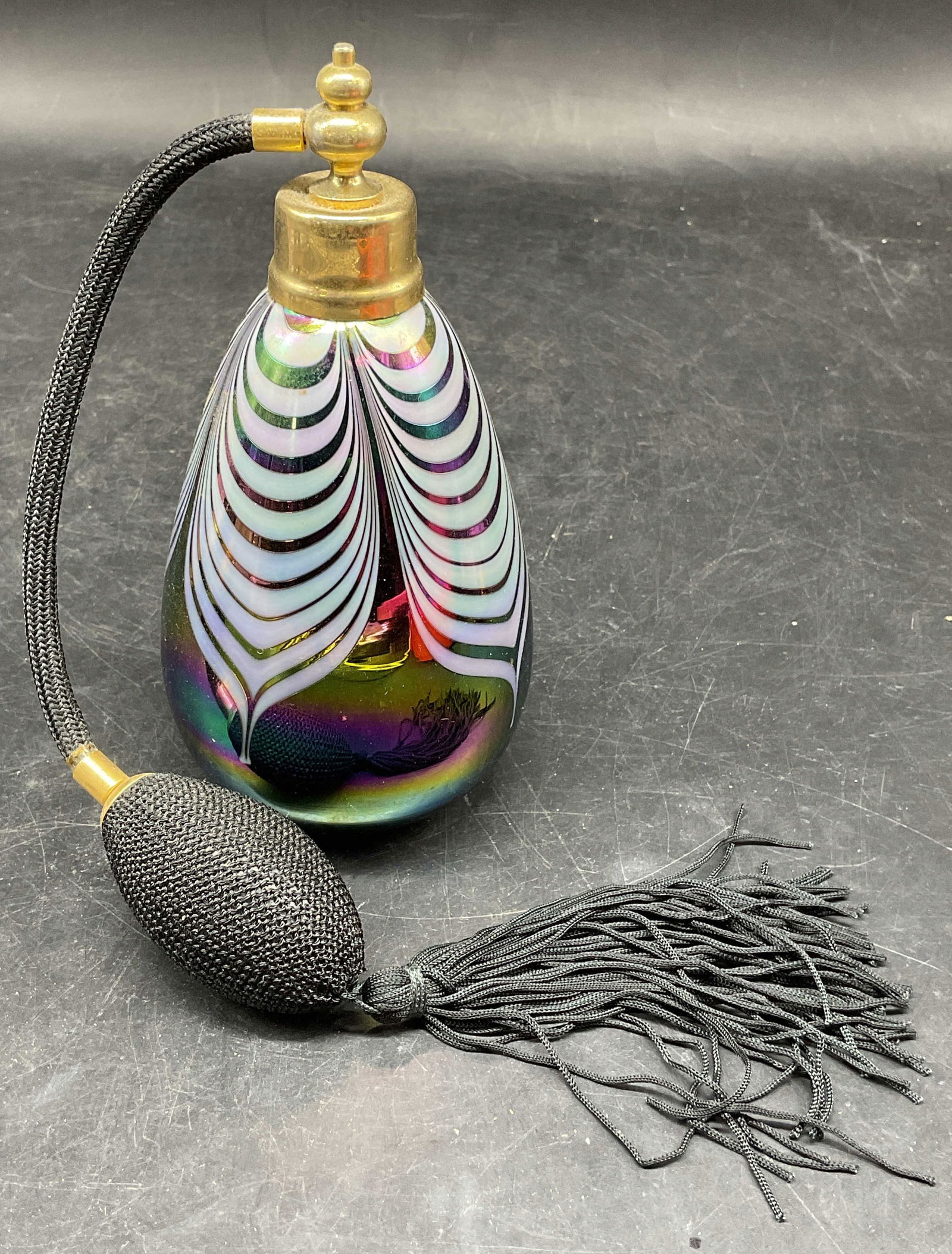 Iridescent Art Glass Feather Pull Perfume Bottle: Iridescent Art glass perfume bottle. With feather pull design. Measures approx. 3 x 6 inches. Some wear consistent with exposure. Perfume bottle, art glass perfume bottle, collectibles, home decor, ho